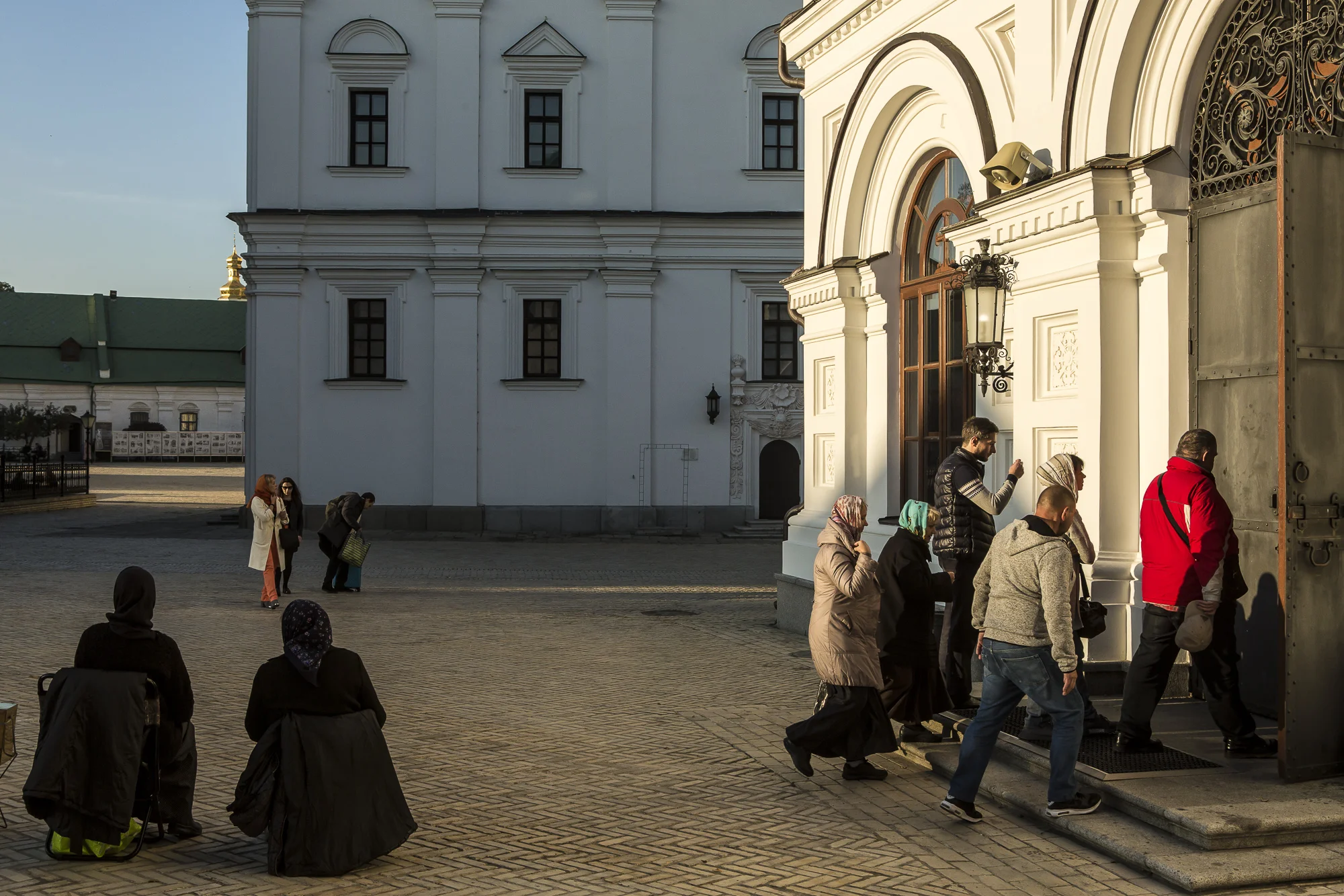 People enter the Refectory Church of Sts. Anthony and Theodosius for the Evening Divine Office at the Kyiv-Pechersk Lavra on Wednesday, October 10, 2018 in Kyiv, Ukraine.