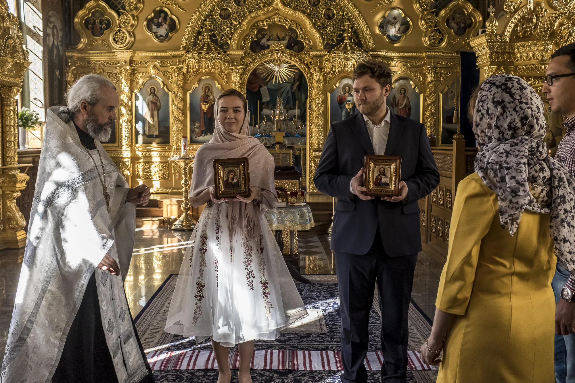 Father Philip, left, leads Katerina, second from left, and Yevgeny Bolonnikov, third from left, during their wedding at Life Spring Church at the Kyiv-Pechersk Lavra on Sunday, October 7, 2018 in Kyiv, Ukraine.