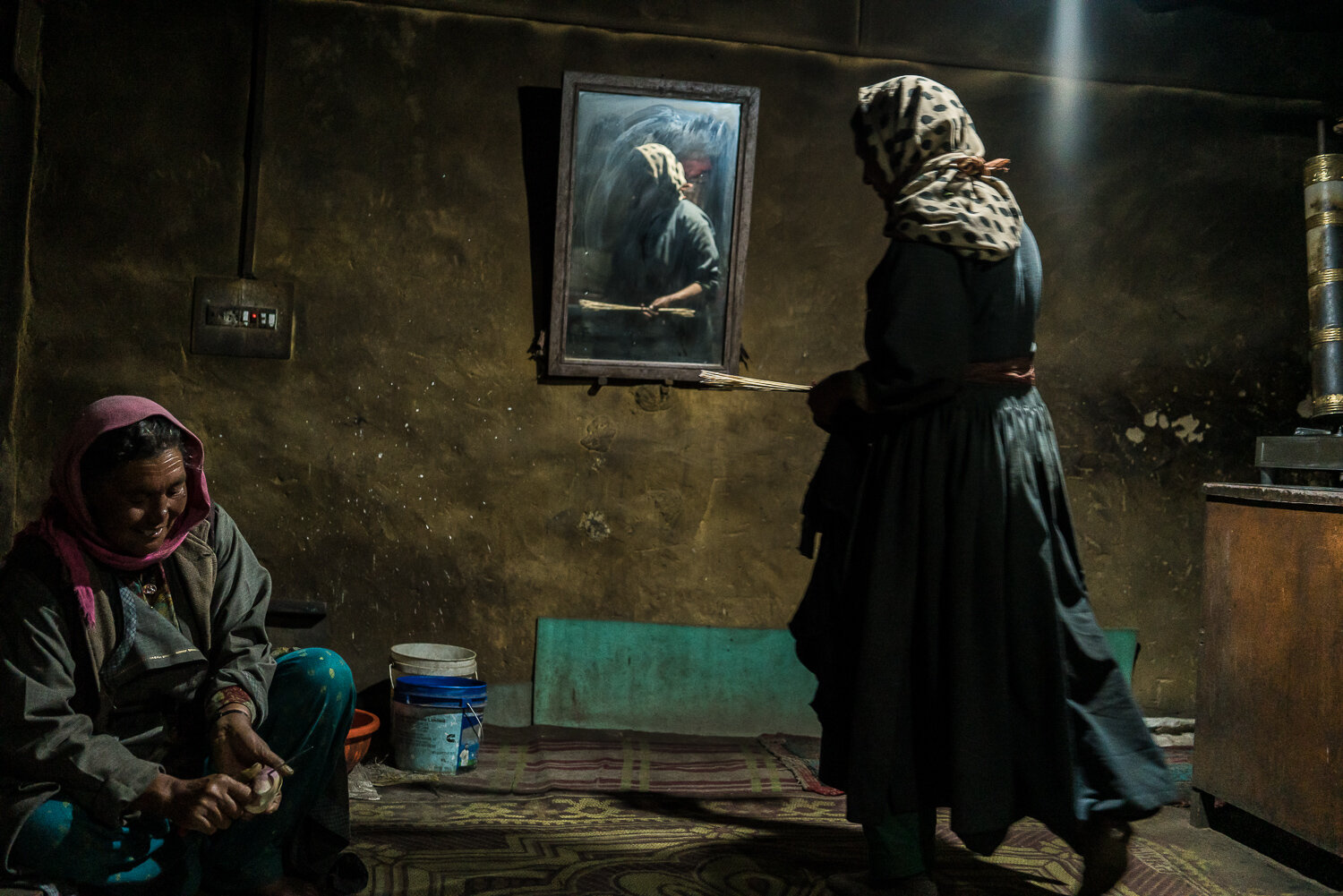  Sisters Tashi Yangzom, left, and Tsering Dolma prepare dinner at home on Thursday, August 15, 2019 in Sharnos, Ladakh, India. 