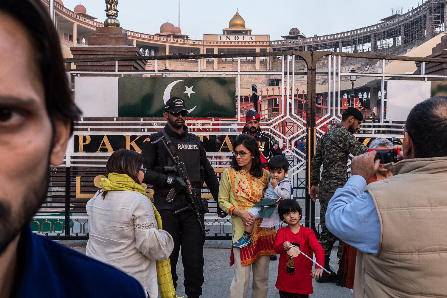  Visitors pose for pictures with border guards following the daily border closing ceremony at the border with India on Friday, November 24, 2017 in Wahga, Punjab, Pakistan. The ceremony draws large crowds on both sides of the border for a nationalist