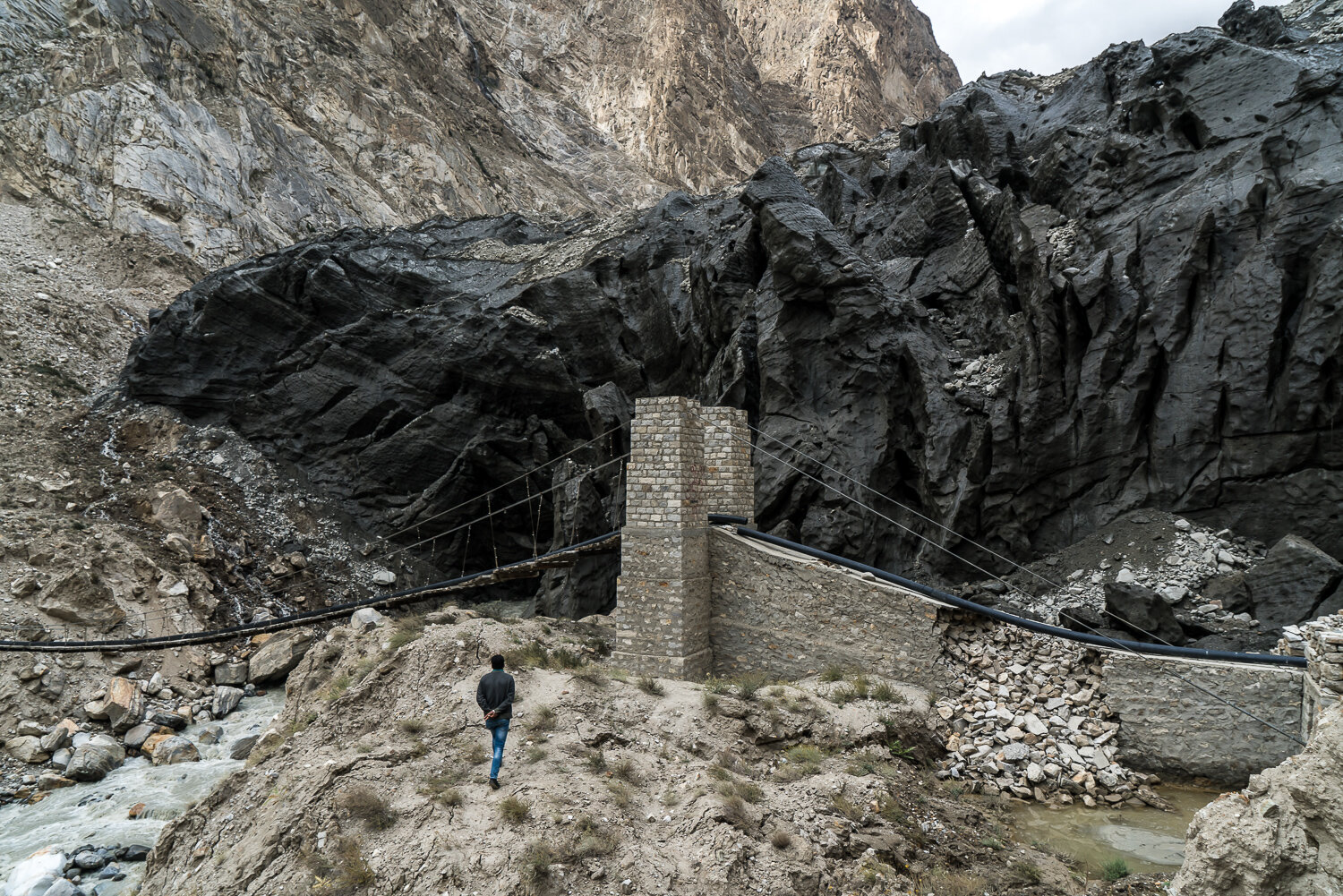  Majeed Ullahbaig walks to a bridge located in front of the Shisper glacier on Friday, October 4, 2019 in Hasanabad, Gilgit-Baltistan, Pakistan. The glacier provides water for drinking and irrigation, but has recently surged downhill substantially, r