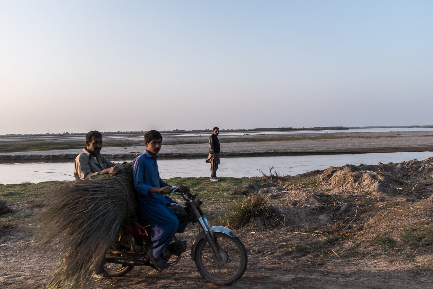  Men along the Chenab River on Saturday, November 18, 2017 in Bosan, Punjab, Pakistan.  The Chenab is one of the main tributaries of the Indus River. 