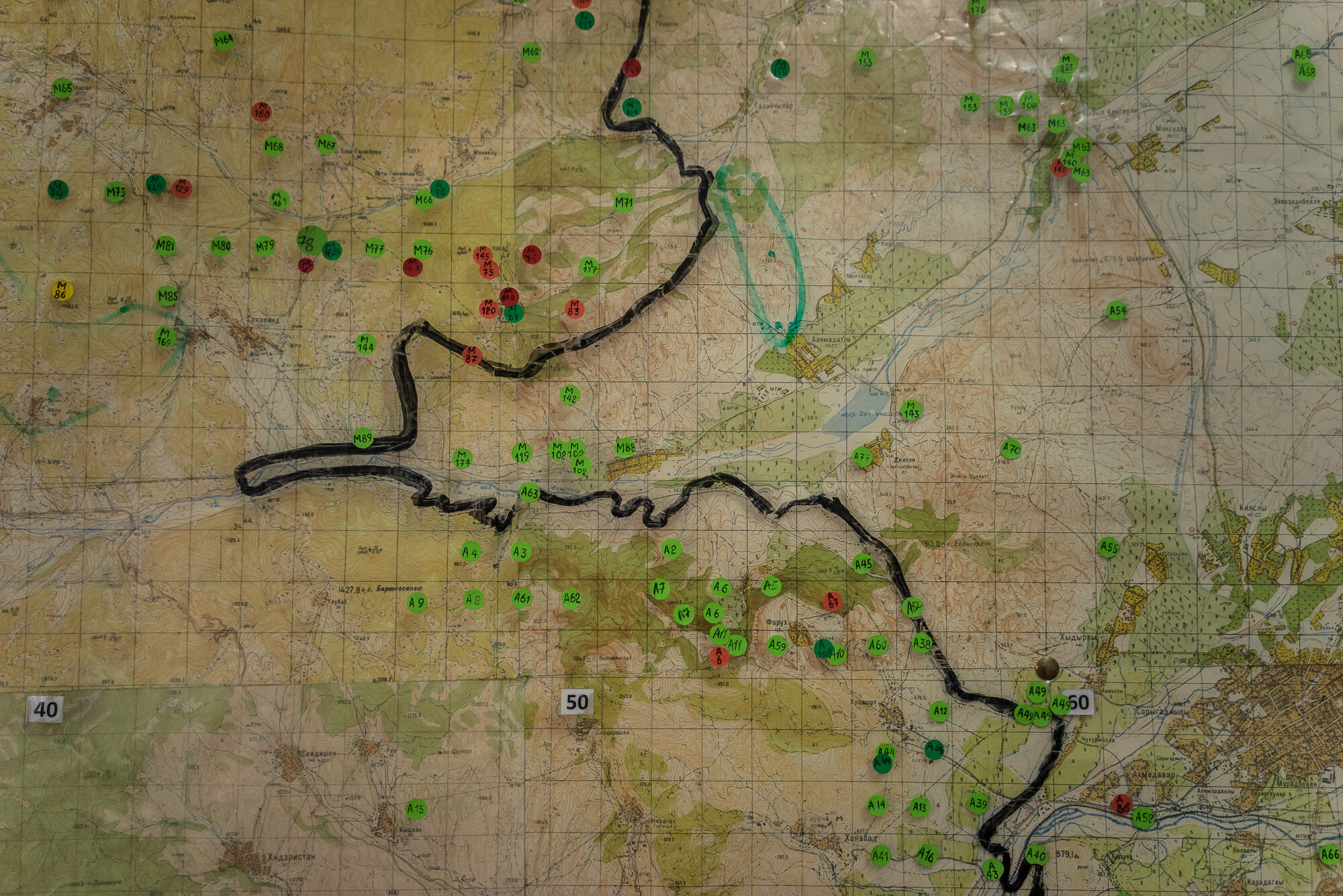  A map showing the locations of already cleared minefields, marked in green, and minefields yet to be cleared, marked in red, at the offices of the charity HALO Trust. Stepanakert, Nagorno-Karabakh. 2015. 