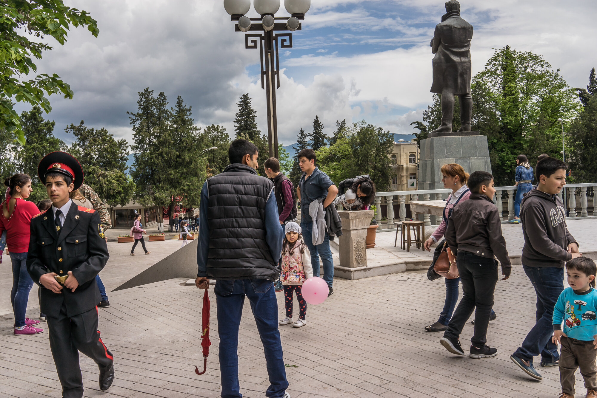  People gather in a local park to enjoy the warm weather following a ceremony commemorating both the victory over Nazi Germany in the Second World War as well as the fall of the strategic town of Shushi to Armenian forces. Stepanakert, Nagorno-Karaba