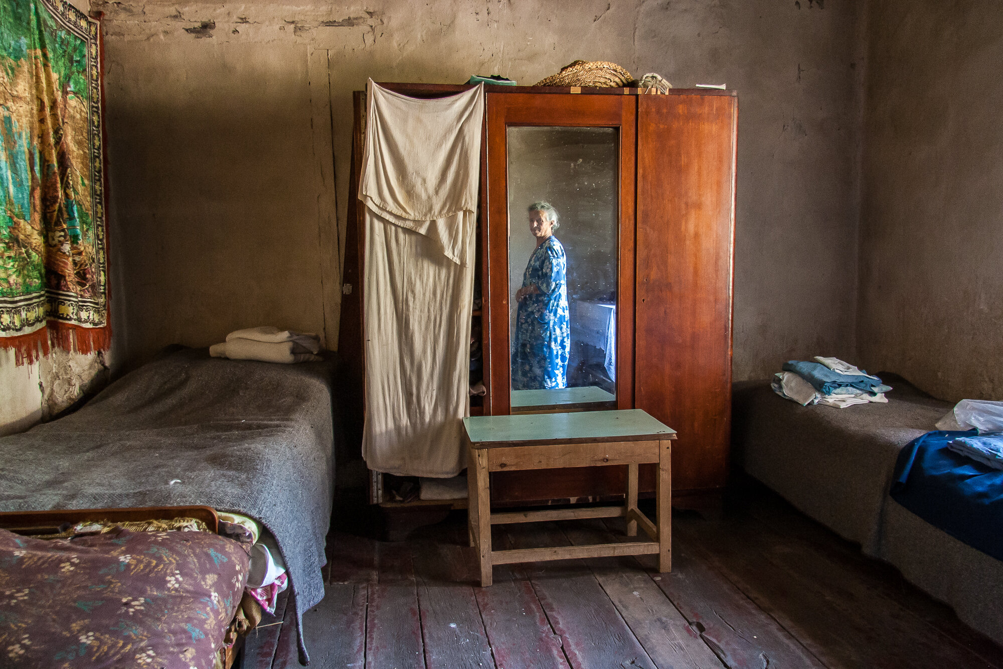  Lina Nersesyan in her village house. Before the war 70 families lived here; Sktaturashen was heavily bombed and now, she and her husband are the only ones who haven't left. Sktaturashen, Nagorno-Karabakh. 2006. 