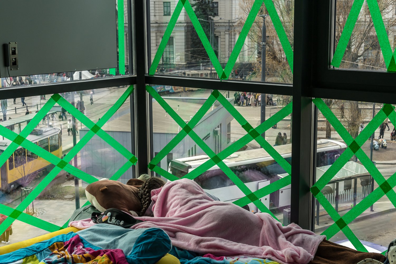  A displaced Ukrainian girl sleeps in a room reserved for women with small children near the main train station on Tuesday, April 12, 2022 in Lviv, Ukraine. 