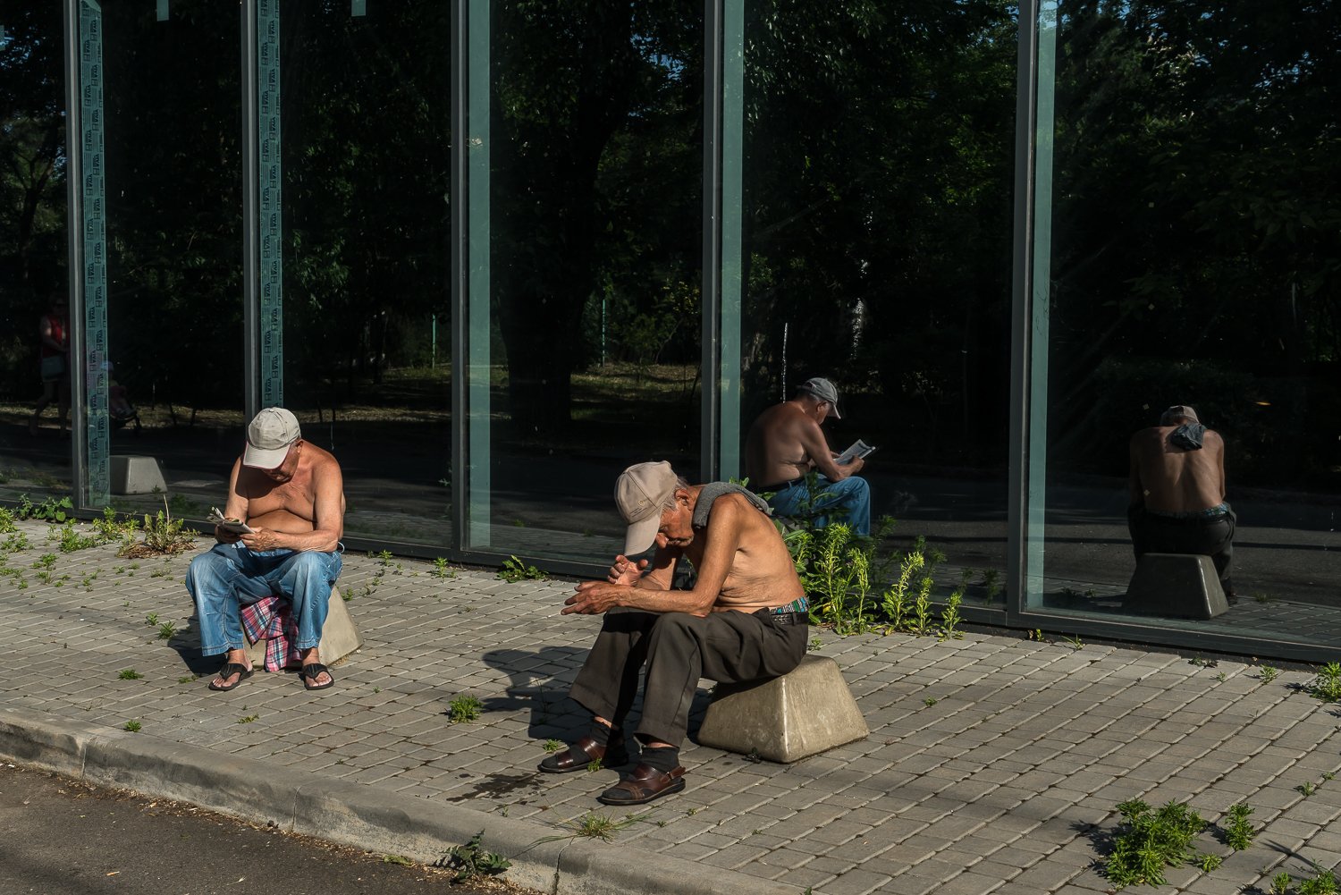  Men soak up the sun on Friday, June 9, 2023 in Odesa, Ukraine. 