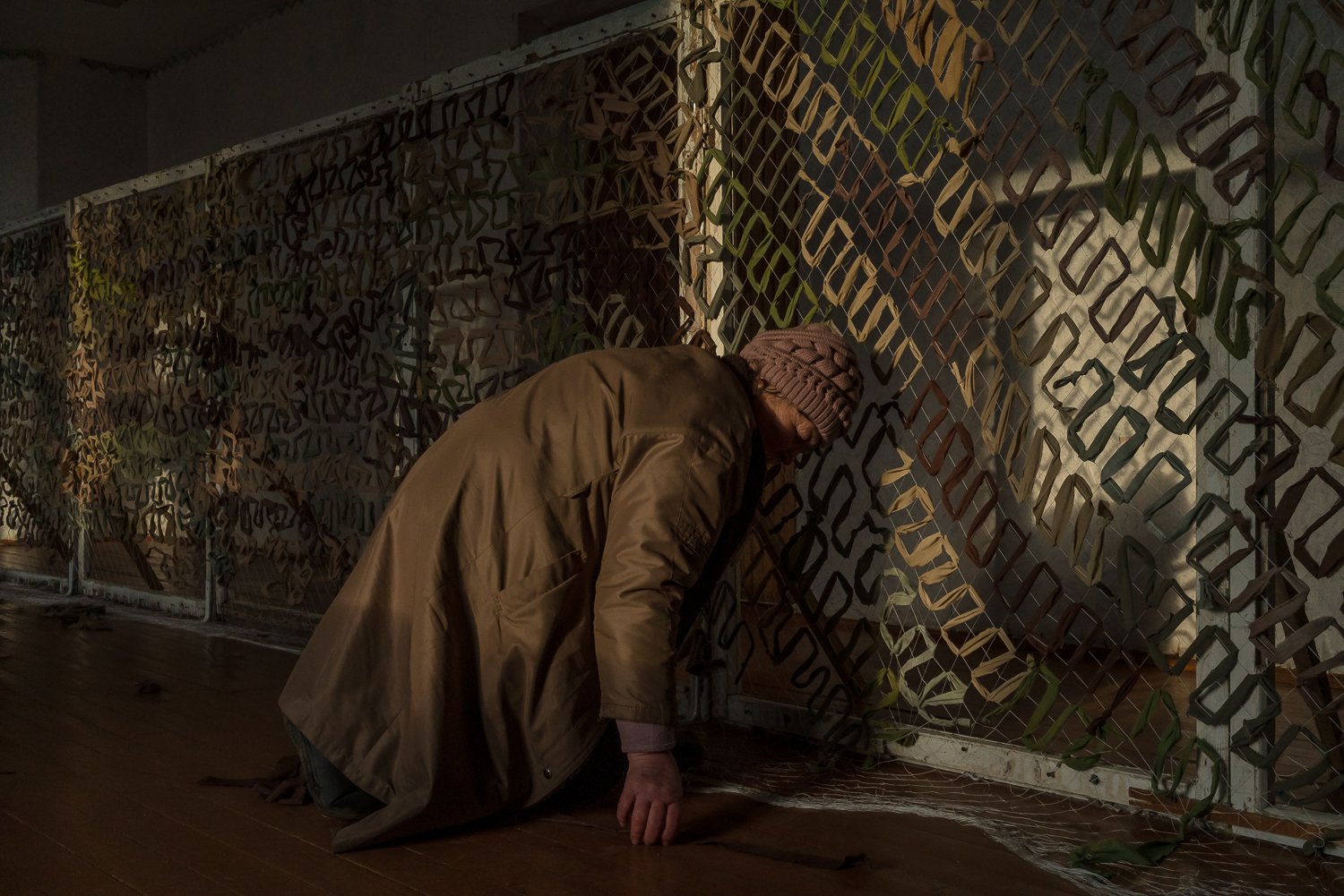  Halyna Kutsenko helps other volunteers to make camouflage nets for the Ukrainian military on Saturday, February 25, 2023 in Sukhyi Yar, Ukraine. Her son is currently in the Ukrainian military and delpoyed near the eastern Ukrainian city of Bakhmut. 