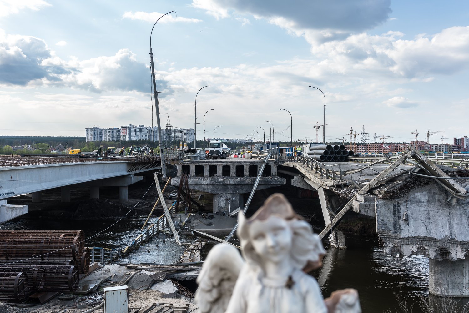  The destroyed Irpin Bridge, which is being replaced by a new bridge at left, on Monday, April 24, 2023 in Irpin, Ukraine. 