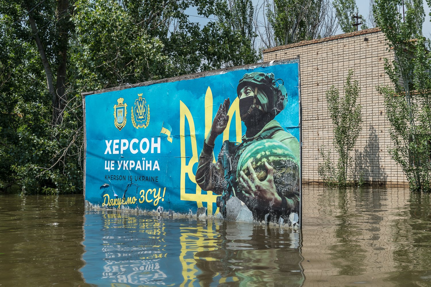  Flood waters reach the bottom of a billboard reading Kherson is Ukraine and thanking the Ukrainian Armed Forces after the destruction of the hydroelectric dam at Nova Kakhovka earlier in the week on Thursday, June 8, 2023 in Kherson, Ukraine. 