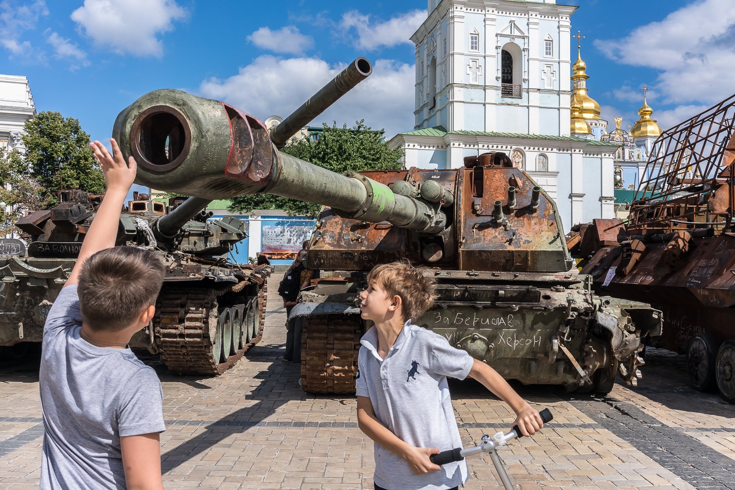  People look at destroyed Russian military equipment put on display on Mikhailivska Square outside St. Michael's Golden-Domed Monastery on Wednesday, August 31, 2022 in Kyiv, Ukraine. 