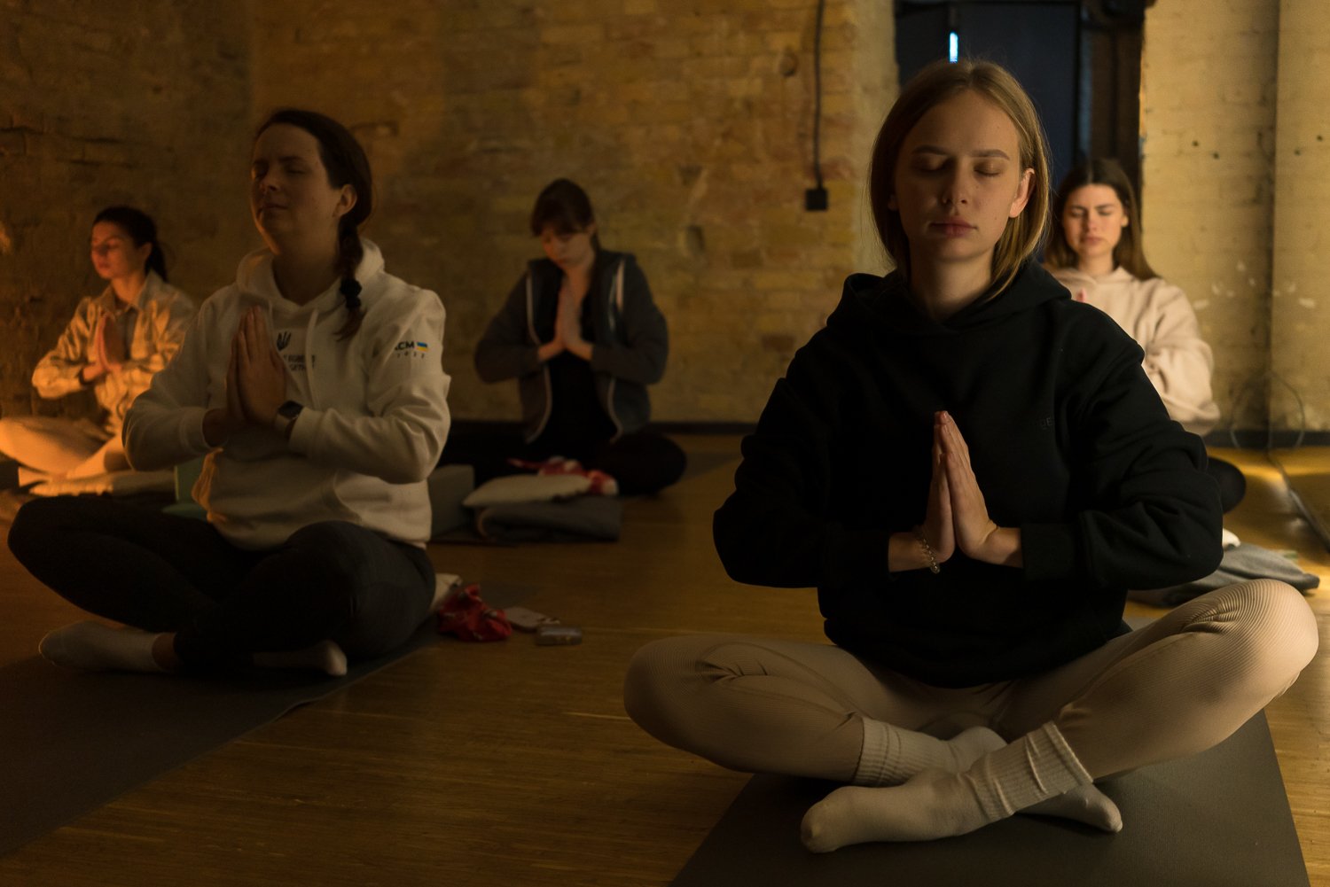  Women participate in a yin yoga class at Sylova Studio on Sunday, January 29, 2023 in Kyiv, Ukraine. Yin yoga, according to class instructor Valeriya Kamenska, helps her practitioners to relax and relieve stress from the war. 