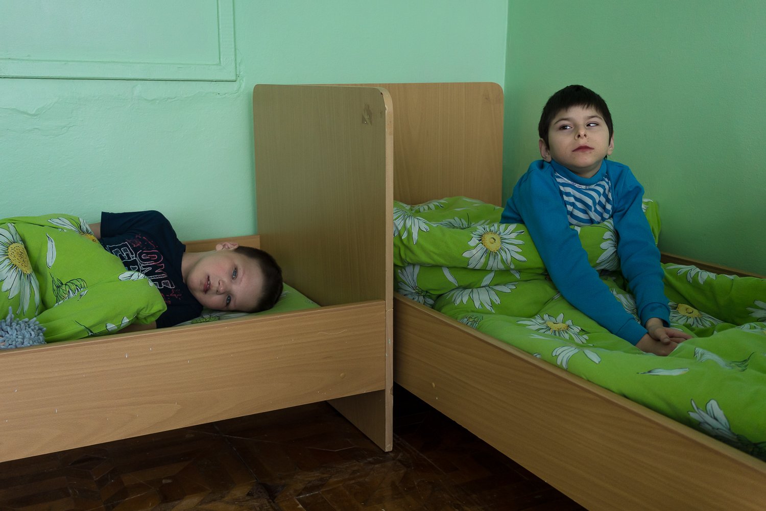  Young clients are put down for a nap at the BlahoDar Center for the Rehabilitation of Children with Disabilities on Monday, February 20, 2023 in Slavutych, Ukraine. People with intellectual disabilities and other special needs have been particularly