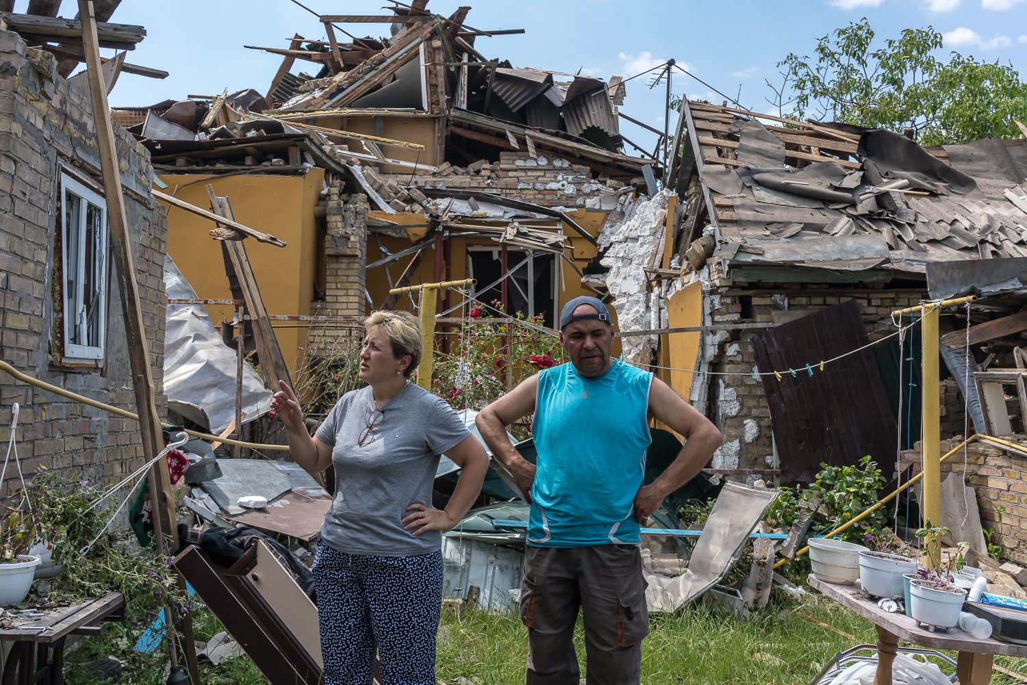  Residents inspect damage and search for personal belongings after a Russian cruise missile that was reportedly shot down by Ukraine's air defense the previous day fell in the village and damaged or destroyed dozens of houses on Saturday, June 17, 20