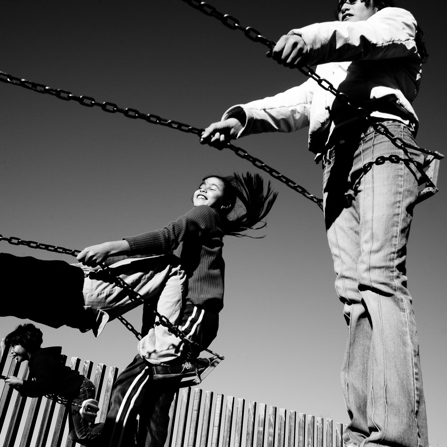  Children play on the playground of the Ignacio Zaragoza Primary School in Palomas, Chihuahua, Mexico. Behind them is the new fence marking the border with the United States. 