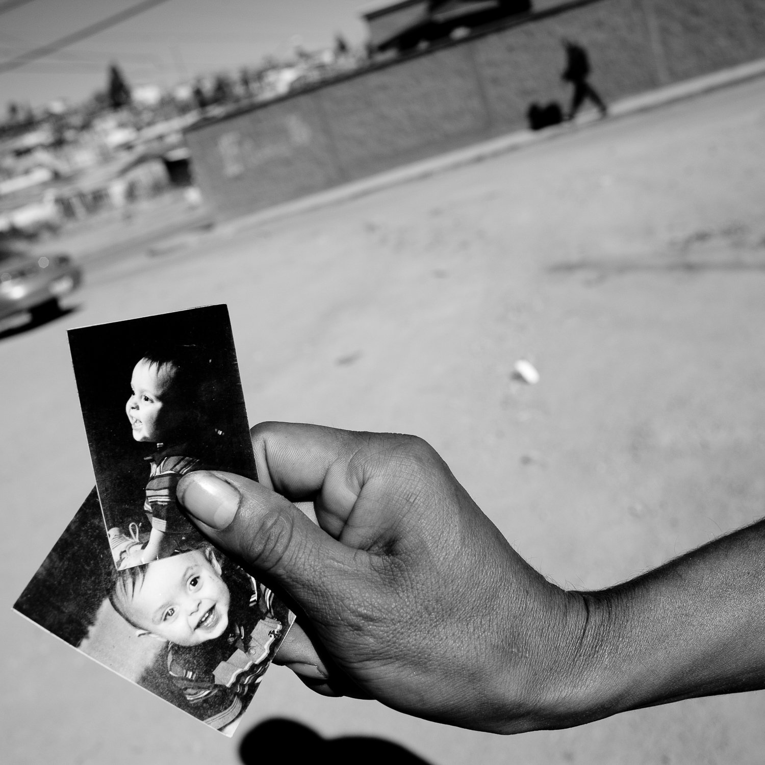  A migrant from Honduras shows photos of his American son in Nogales, Sonora, Mexico. The man lived in Tennessee for years but was unable to begin the citizenship process by marrying his girlfriend because Tennessee does not recognize marriages by un