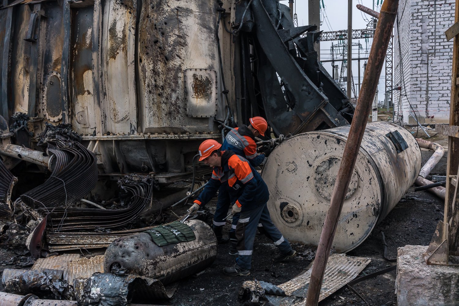  Ukrenergo employees work to repair damage to a transformer at a high-voltage electrical substation caused by an October 17 Russian missile strike on Thursday, November 10, 2022 in central Ukraine. 