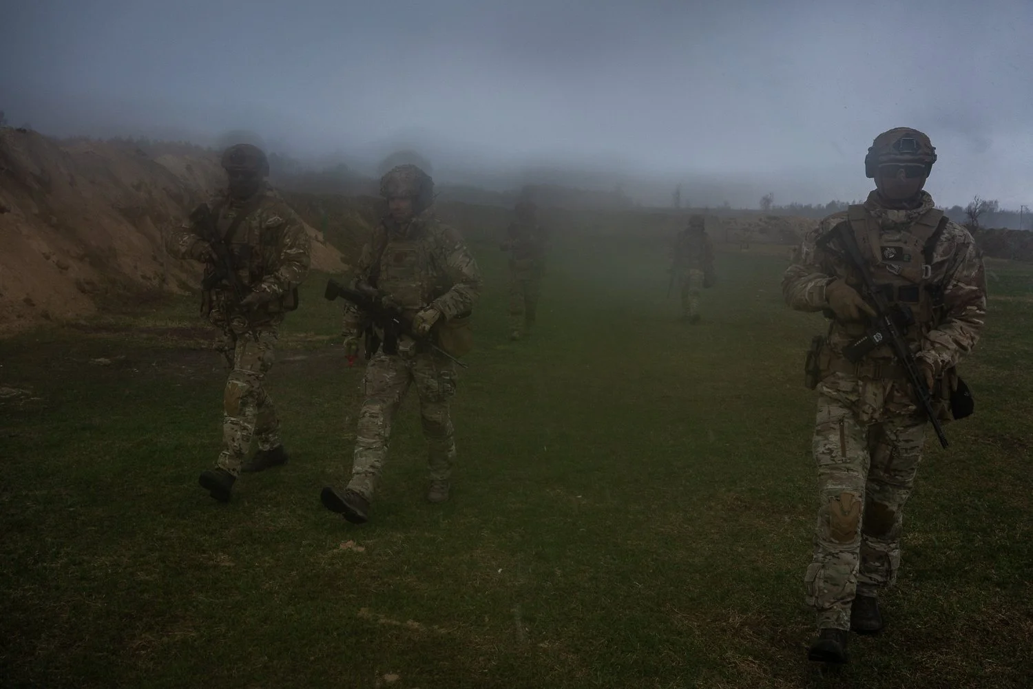  Soldiers from the 28th Regiment of the National Guard of Ukraine take part in a training during a sudden downpour on Tuesday, April 7, 2026 in the Chernobyl Exclusion Zone, Ukraine. The area was closed off to the public due to radioactive contaminat