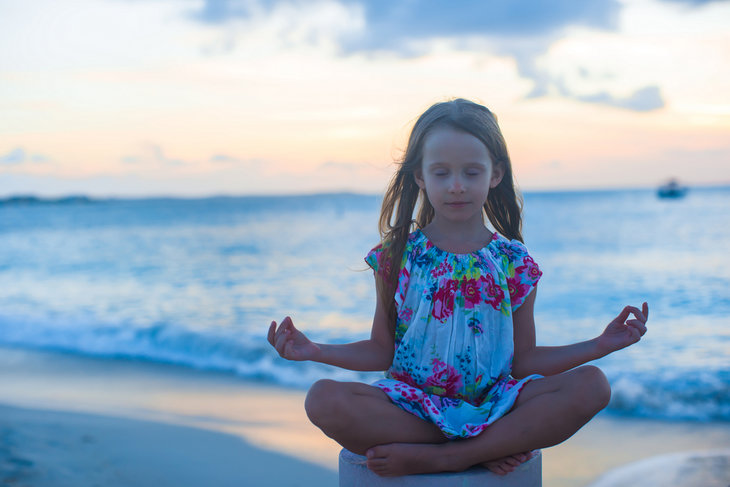 Short moments of meditation are taught to help Berthold Academy students center themselves between transition times.