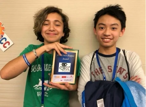 Coding Club members Kacey Banga and Zachary Wong representing Berthold Academy and holding the Grace Hopper Award at the Robotics competition