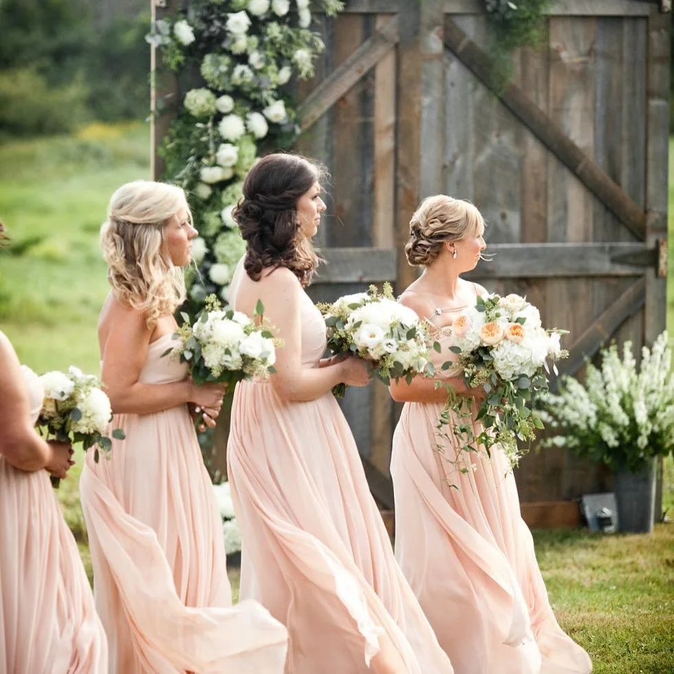 The bridesmaids&rsquo; expressions say it all...beautiful day!
