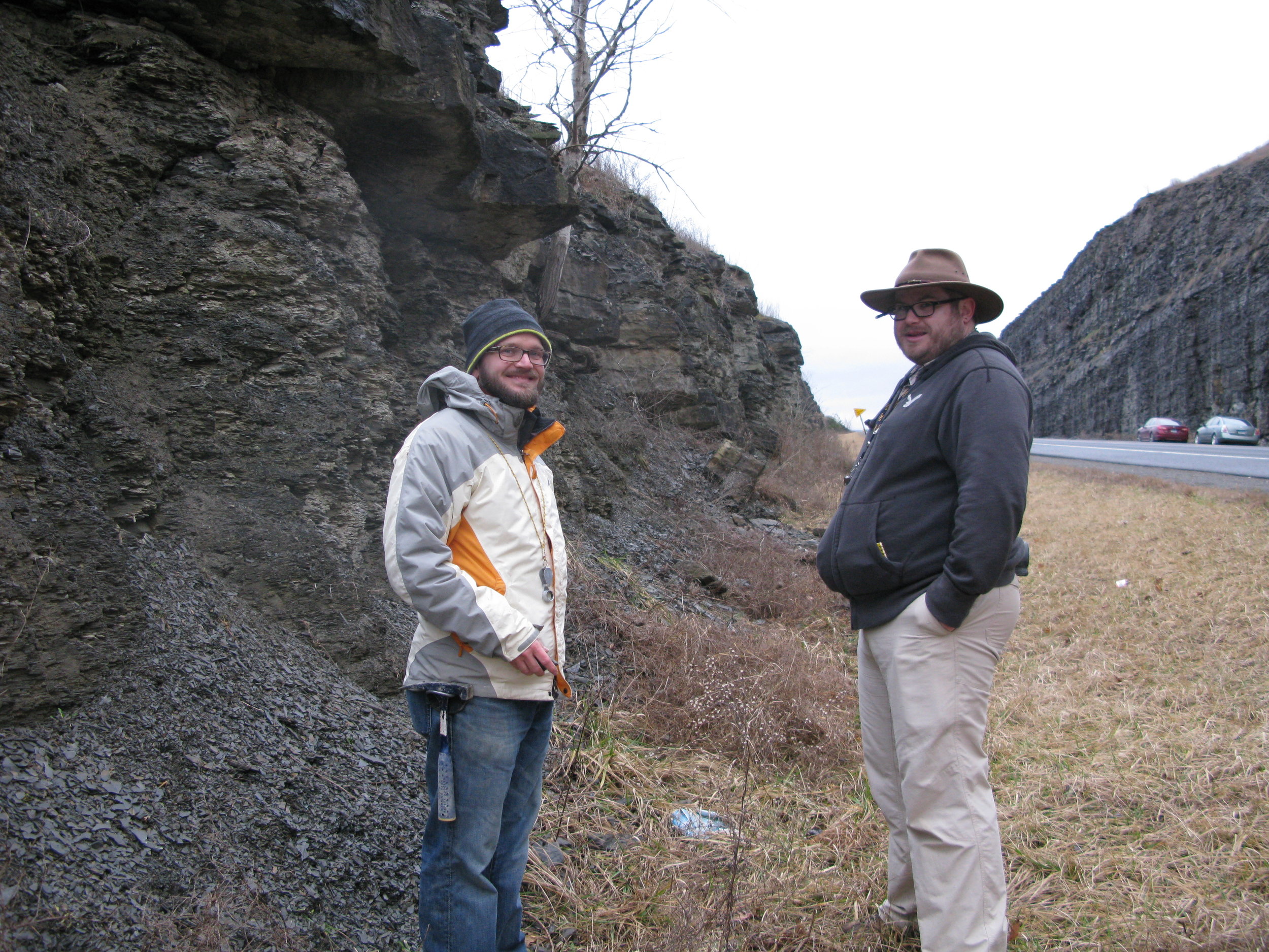Figure 2. Photo of my advisor Dr. Andrew Bush (left) and myself (right) at an Upper Devonian outcrop near Tioga, PA. The shale is the Pipe Creek Formation, approximately the Lower Kellwasser extinction horizon