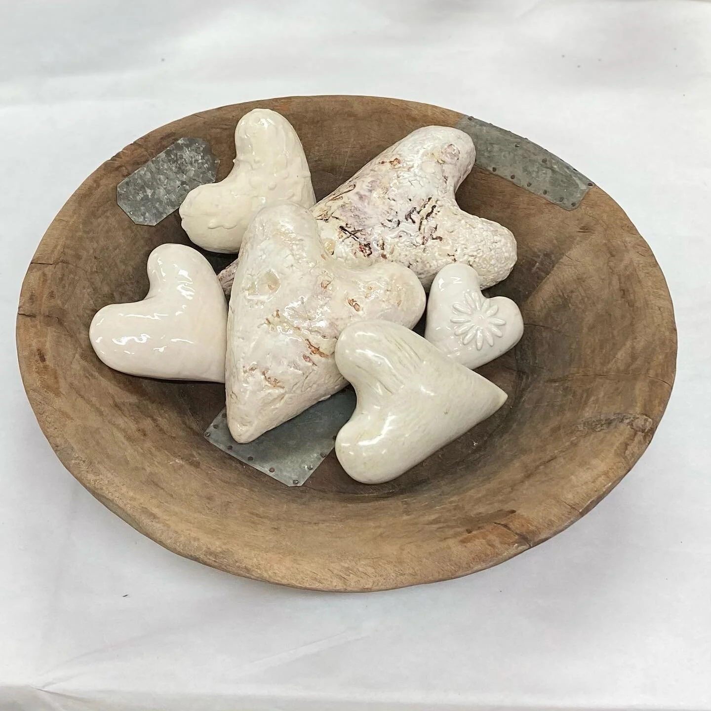 A collection or just the two? Xtra lg crusty hearts and a large 18&rdquo; wood bowl with metal - a yummy combination. Simple. dM me for details on creating tablescapes with hearts and bowls or trays.