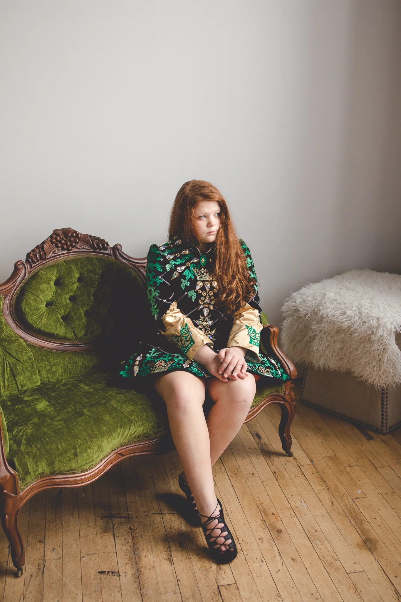 girl in green Irish Dance costume staring out window - Plymouth, MN Family Photographer