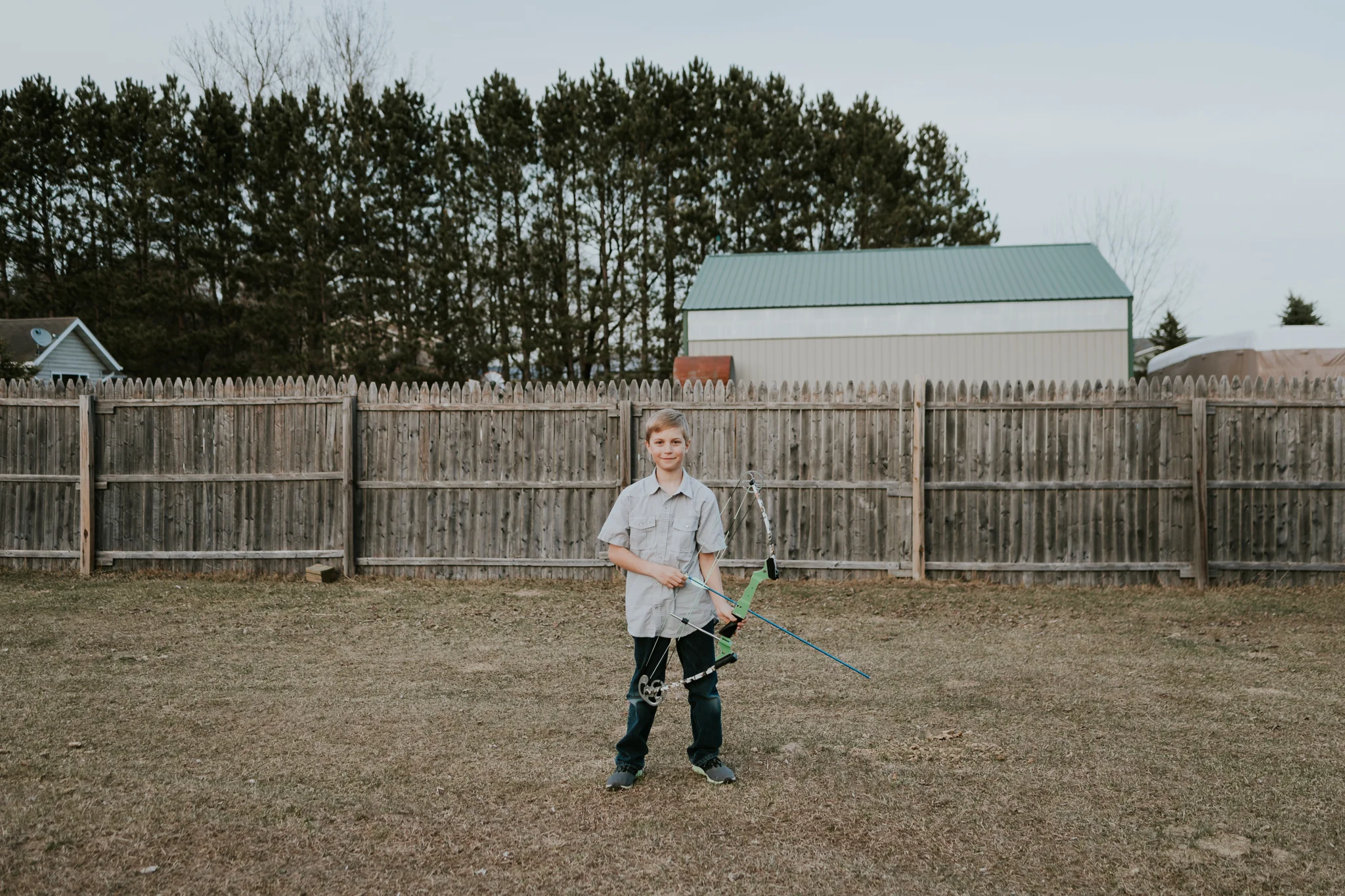 boy holding a bow and arrow - AMG Photography