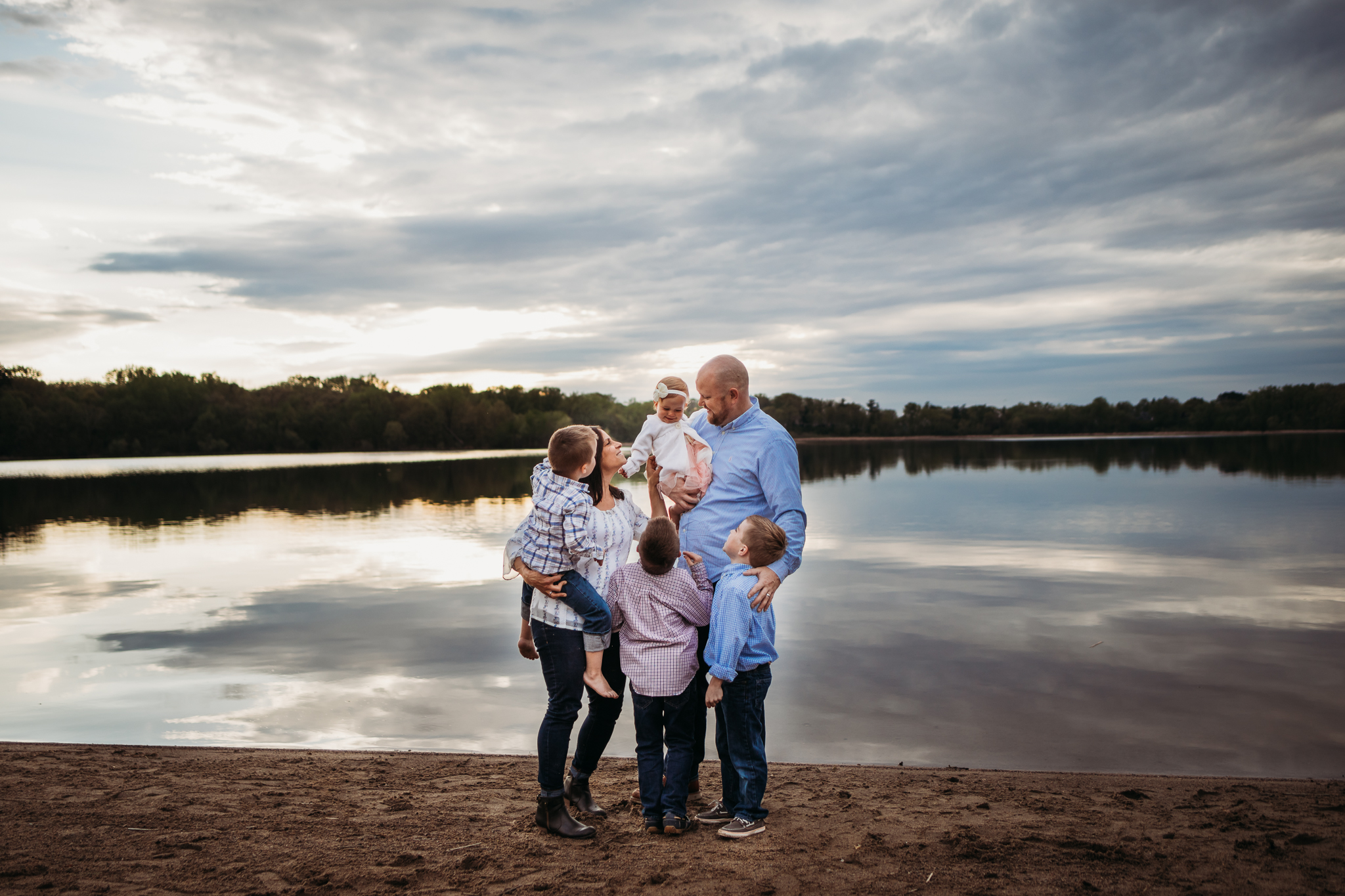 family of 5 standing by a lake - AMG Photography