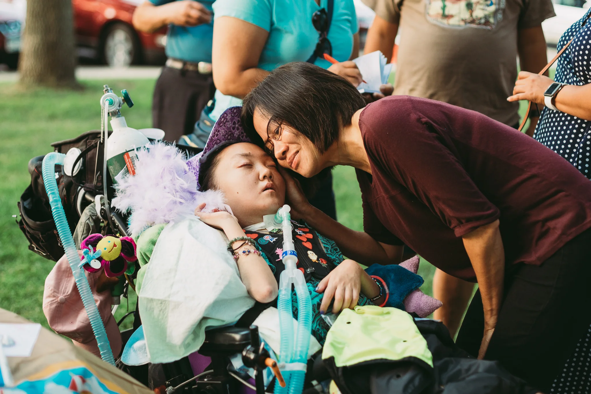 woman hugging girl in wheelchair - Minnesota Special Needs Photographer