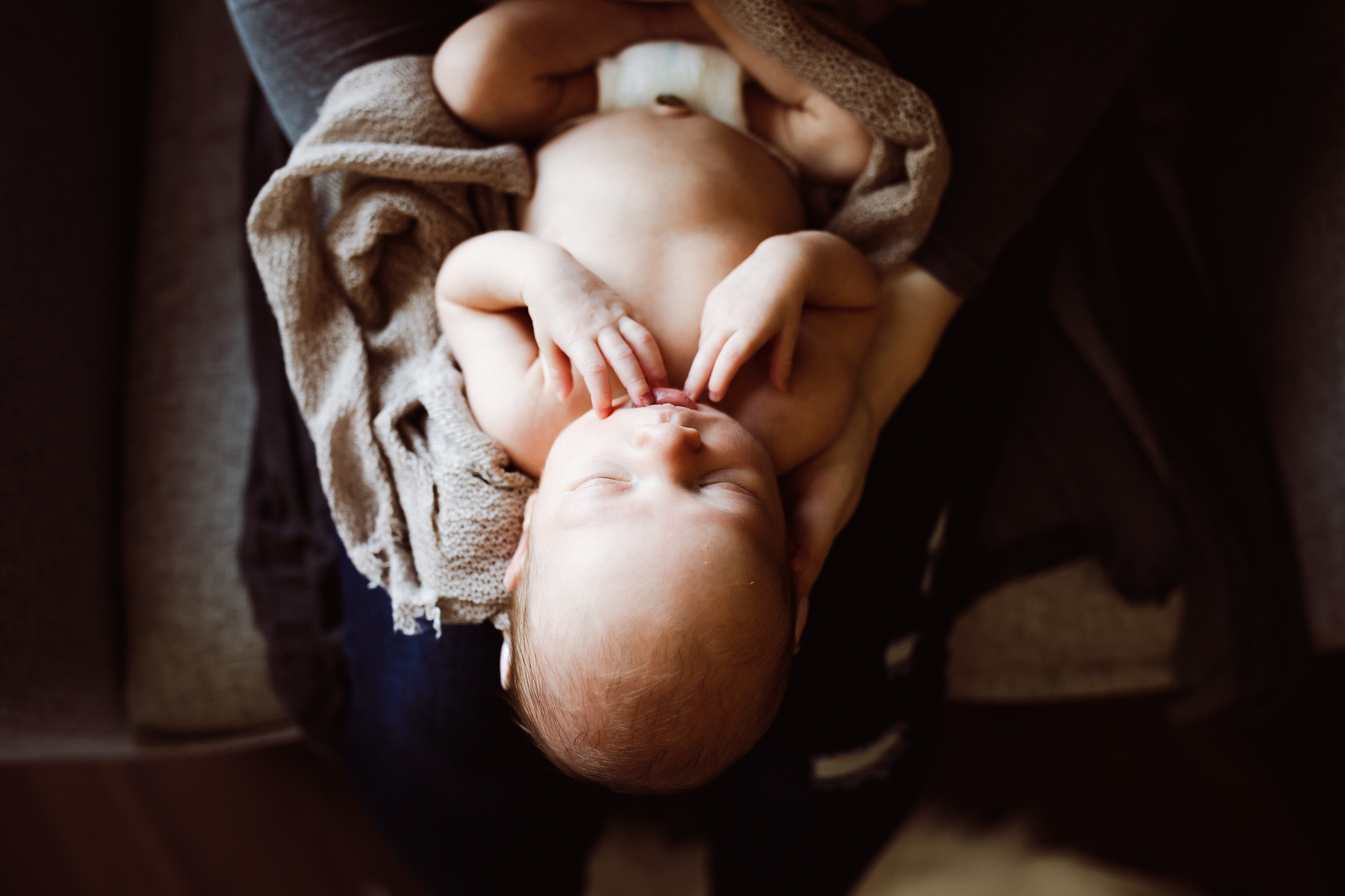 baby boy sitting on mom’s lap - AMG Photography