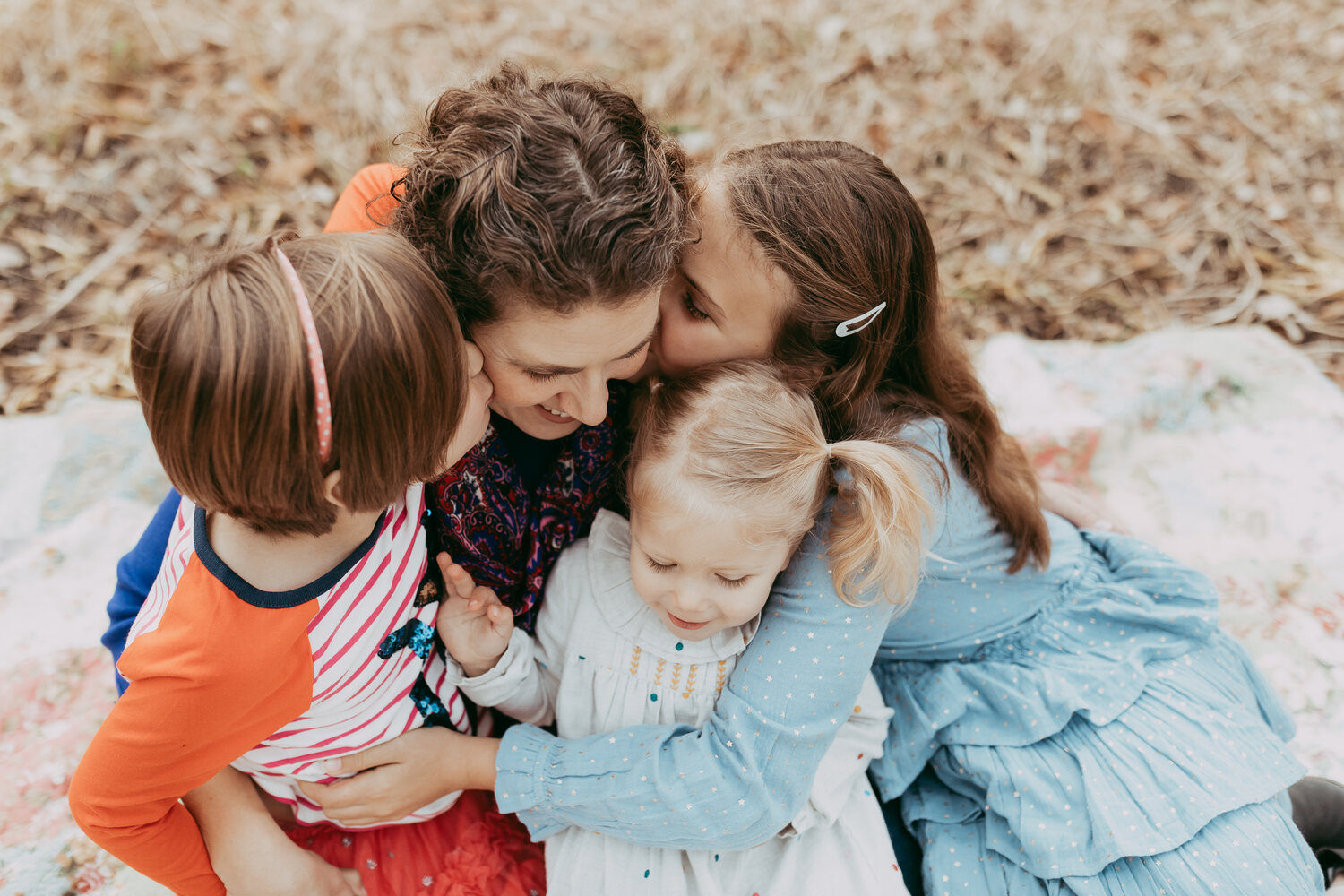 momma cuddling with her three daughters in the Fall - Minnetonka Family Photographer