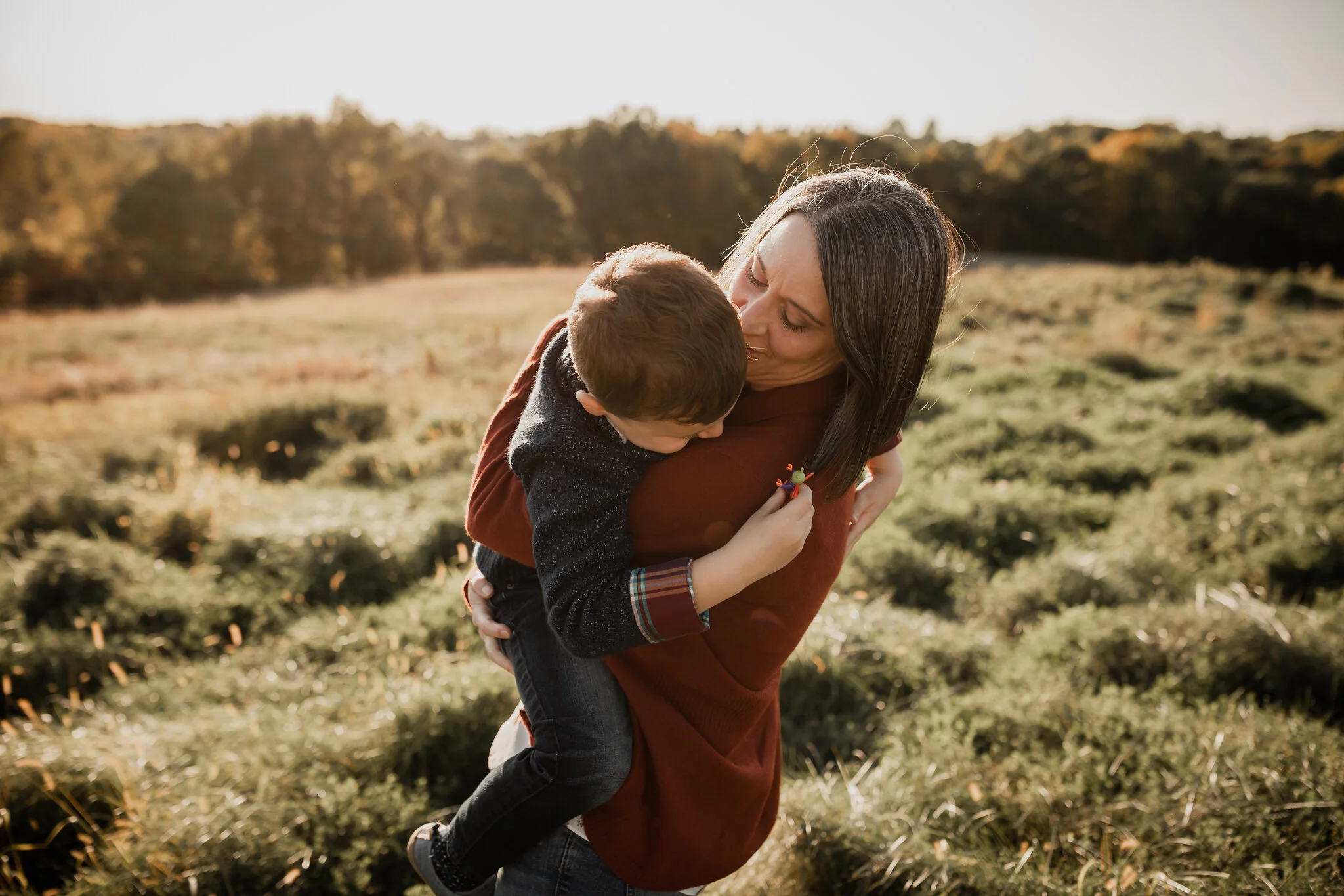 mom hugging her little boy at the Minnesota Landscape Arboretum | Minnesota Family Photographer