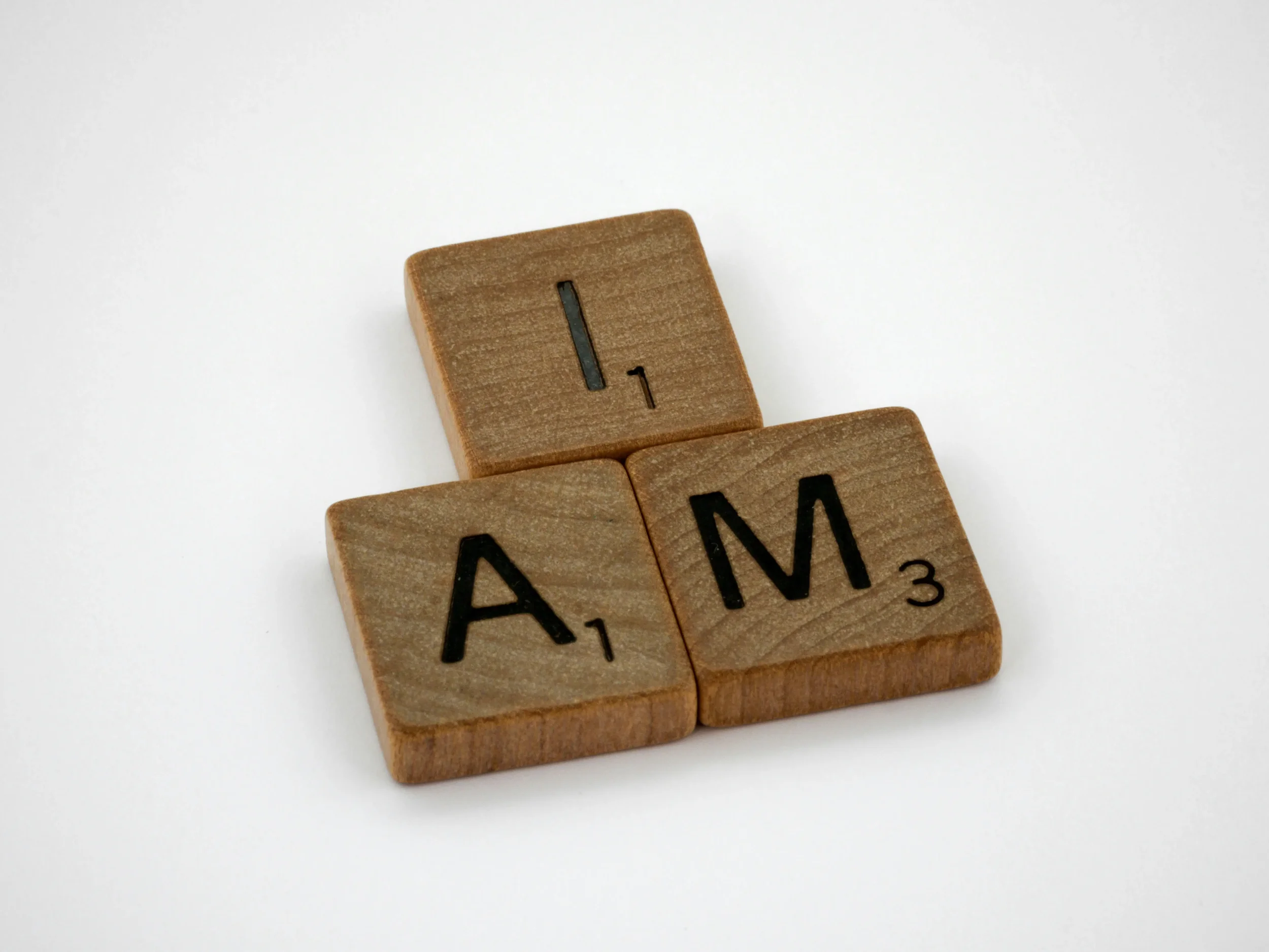 Scrabble letters reading "I am"
