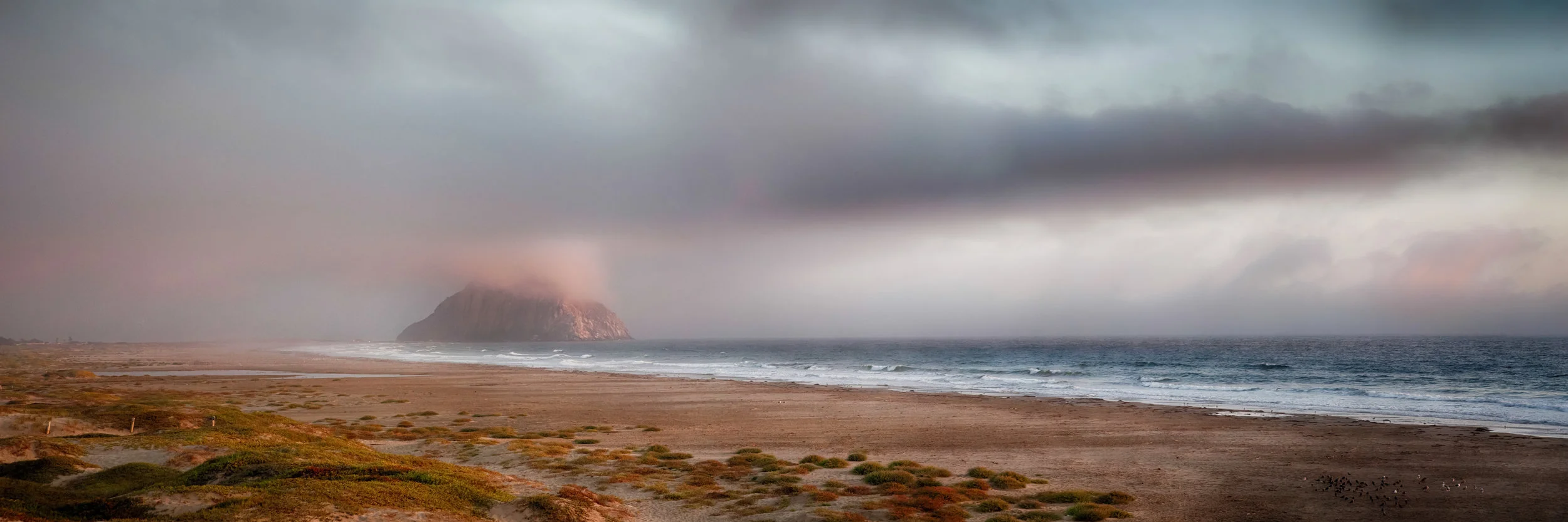 Morro Rock sits in the fog