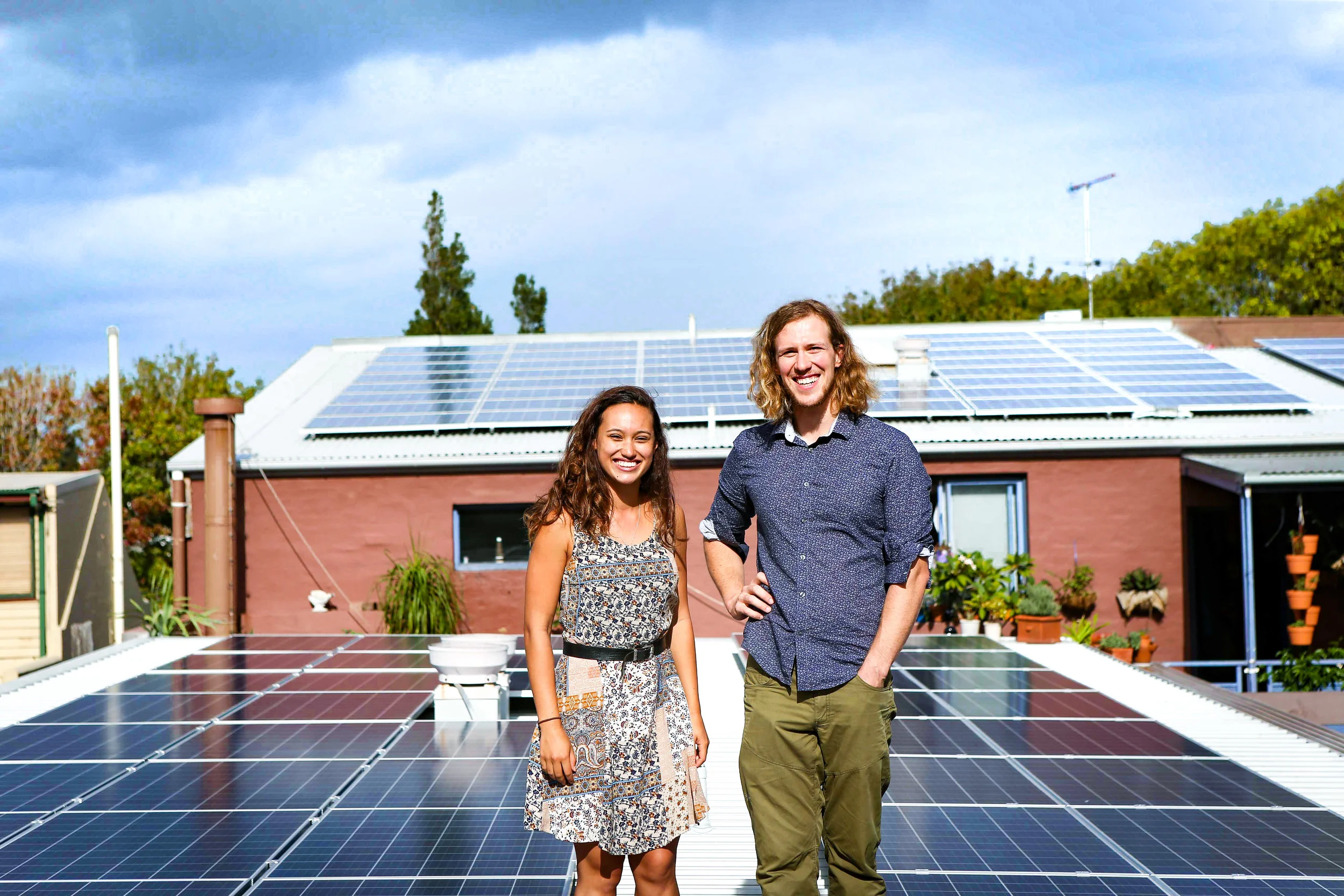 Dr Bjorn Sturmberg and Stucco President Sarah King amongst Stucco's solar panels. Photo: Katherine Griffiths, City of Sydney