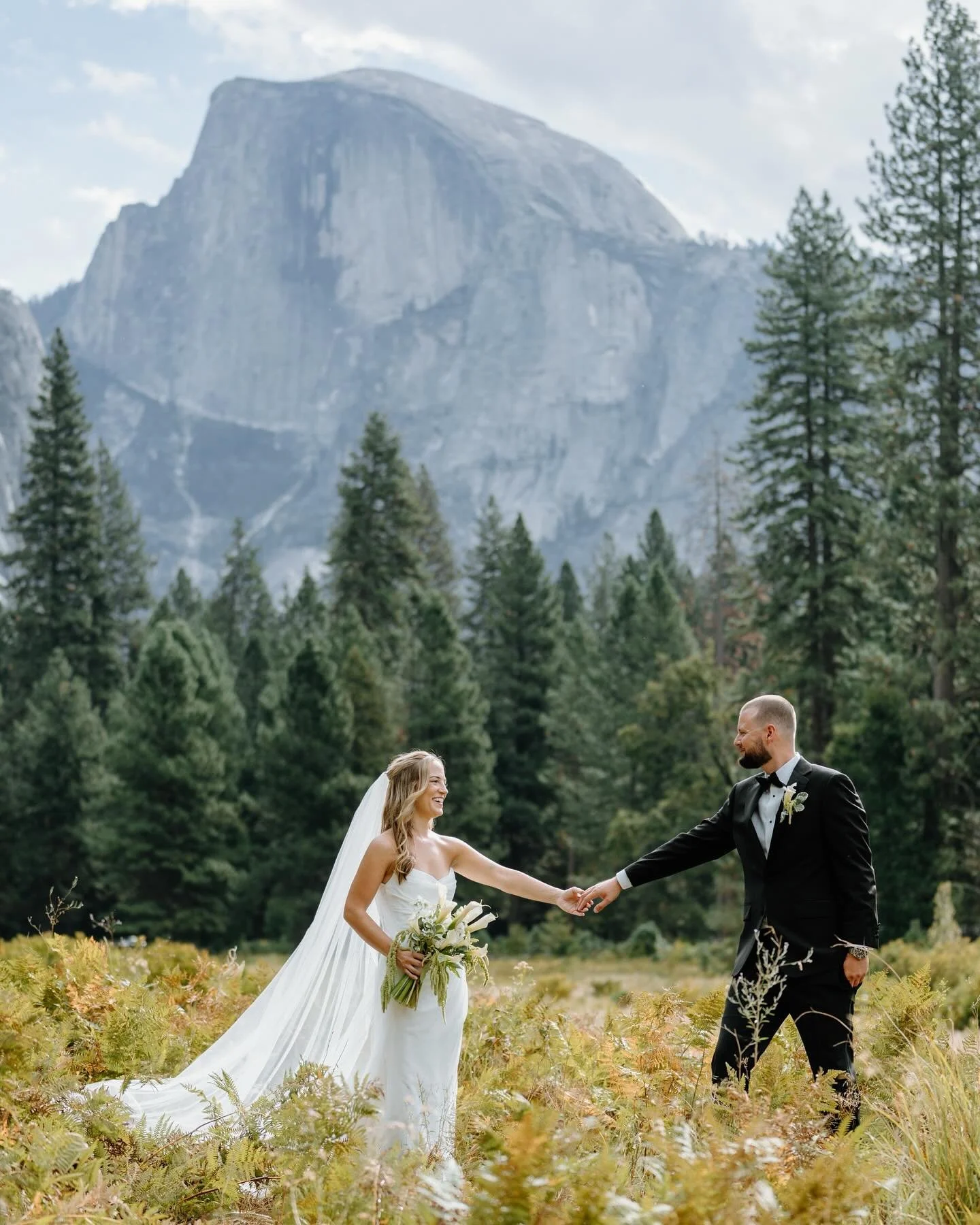 Yosemite has a way of making love feel even bigger.
After an intimate first look and heartfelt vows at Cathedral Beach, Darcy + Jordan&rsquo;s celebration at The Ahwahnee was filled with calm, laughter, and the kind of beauty you can&rsquo;t fake.

C