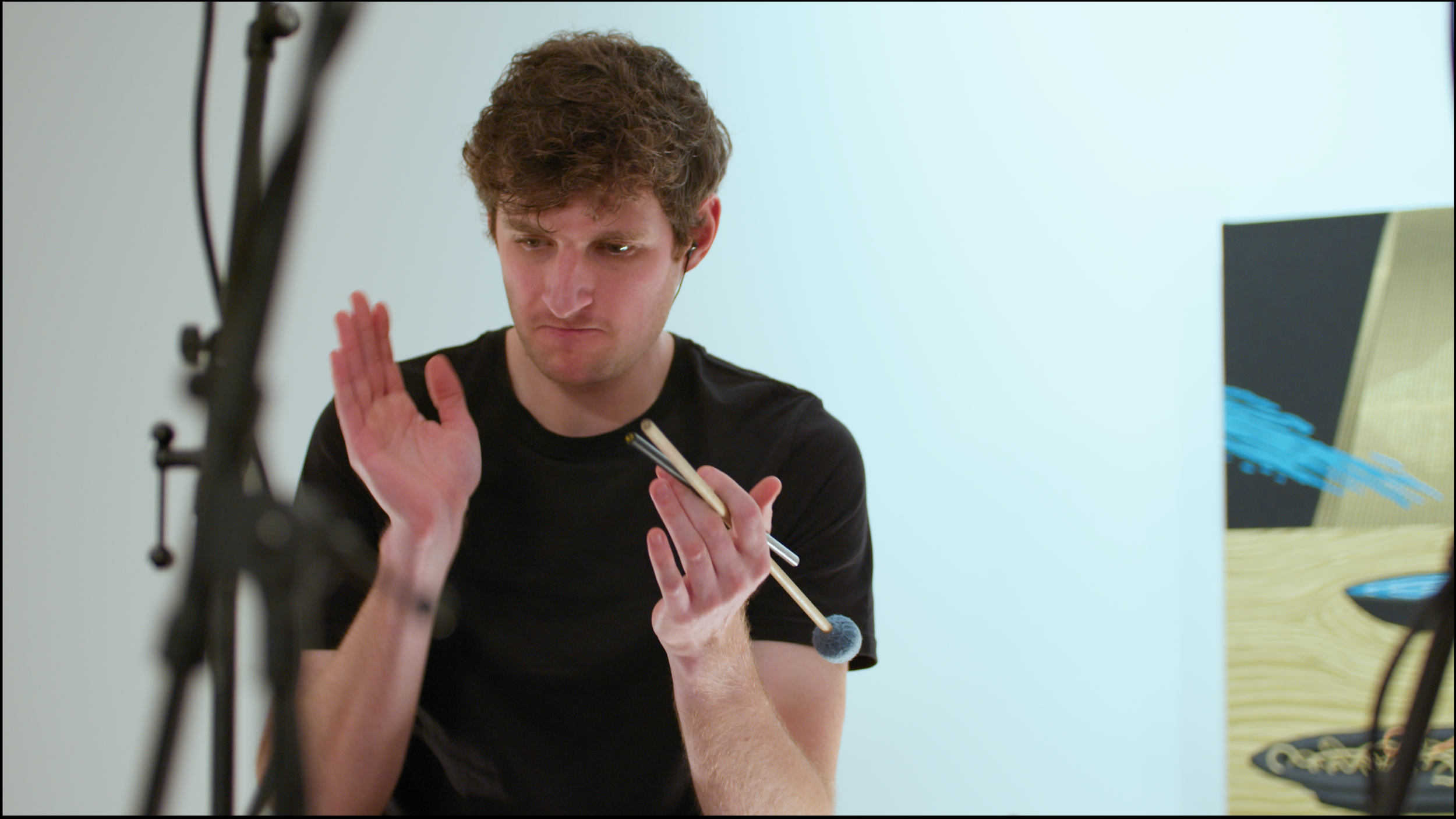 8. A close-up image of a percussionist clapping their hands.