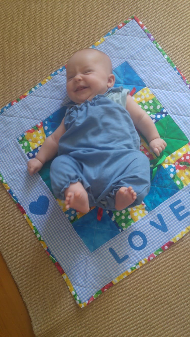 baby and blue quilt.jpg