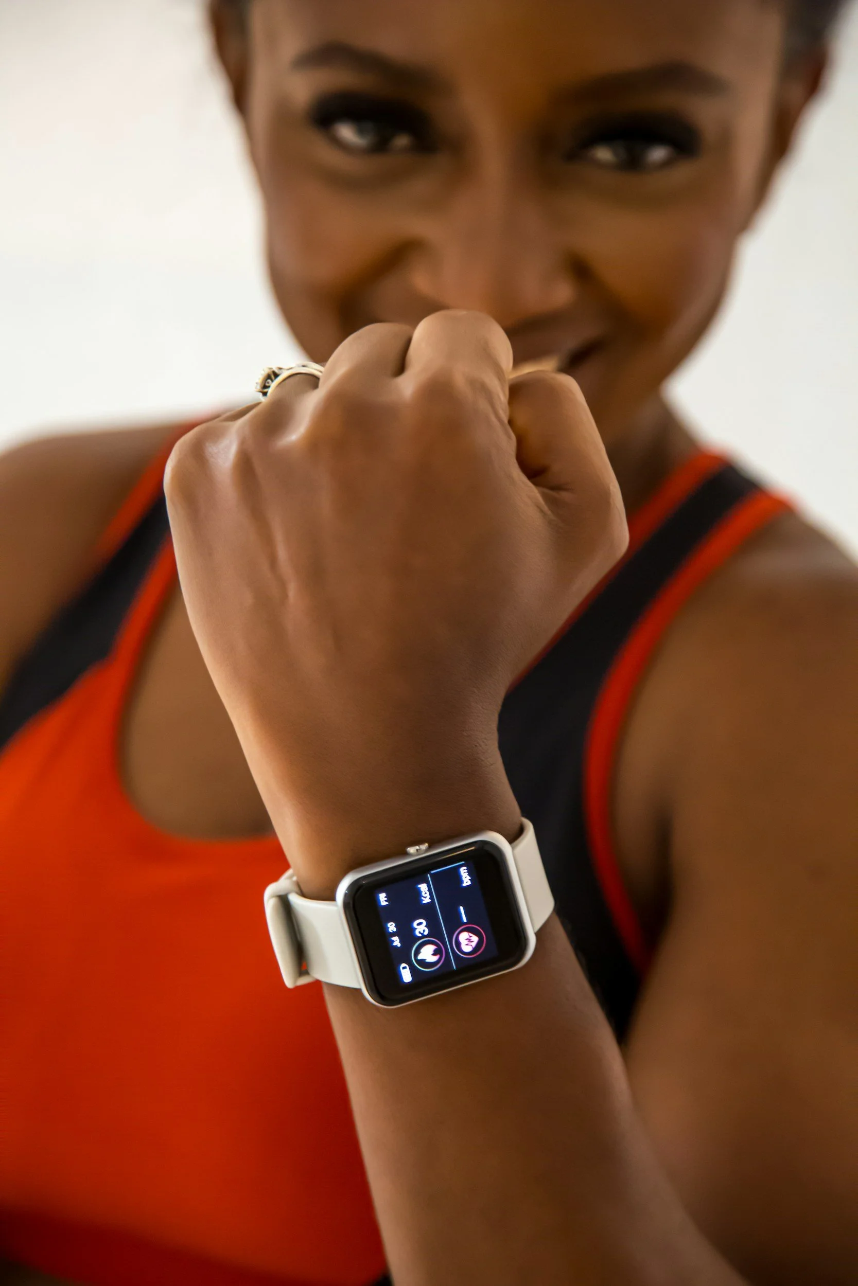 Woman showing her watch with fitness metrics on it