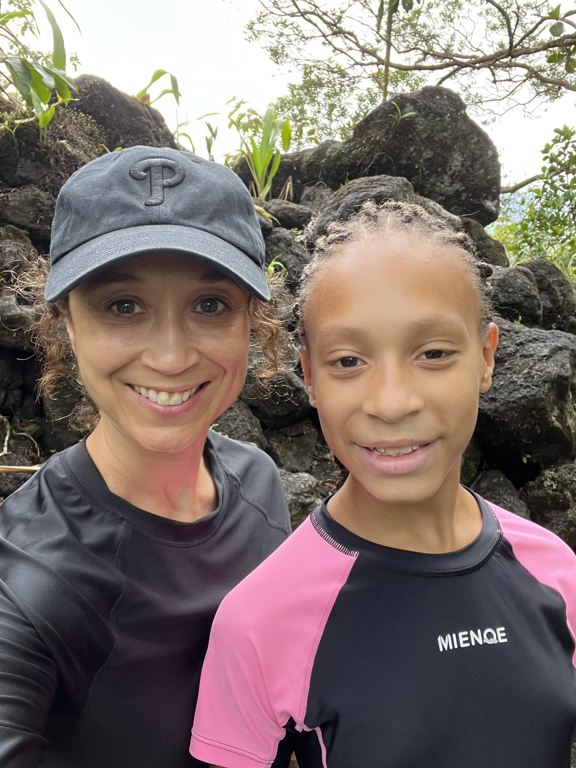 Ashley hiking a volcano with her daughter