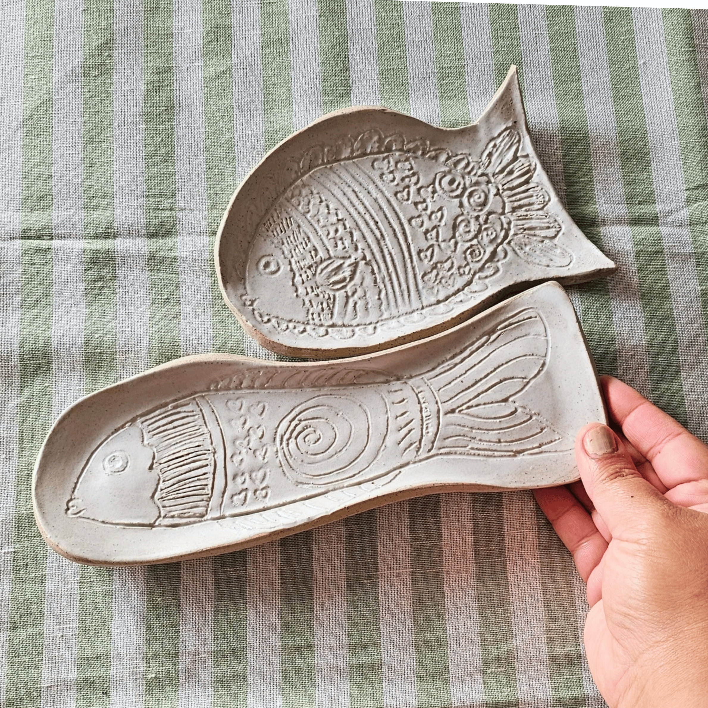Just Keep Swimming_group_flatlay_curved trays_in hand.png