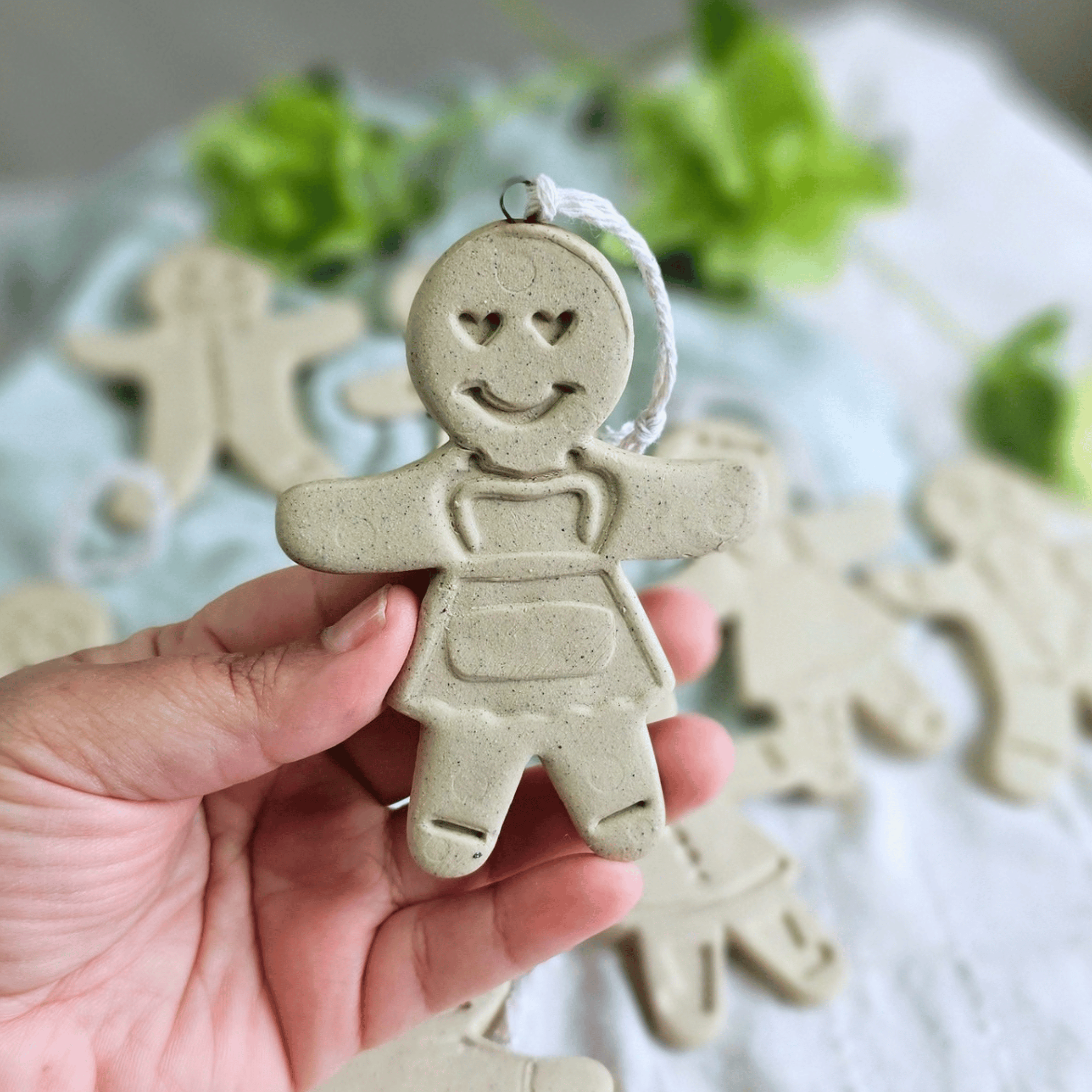 Gingies_raw clay_flatlay_in hands_heart eyes.png