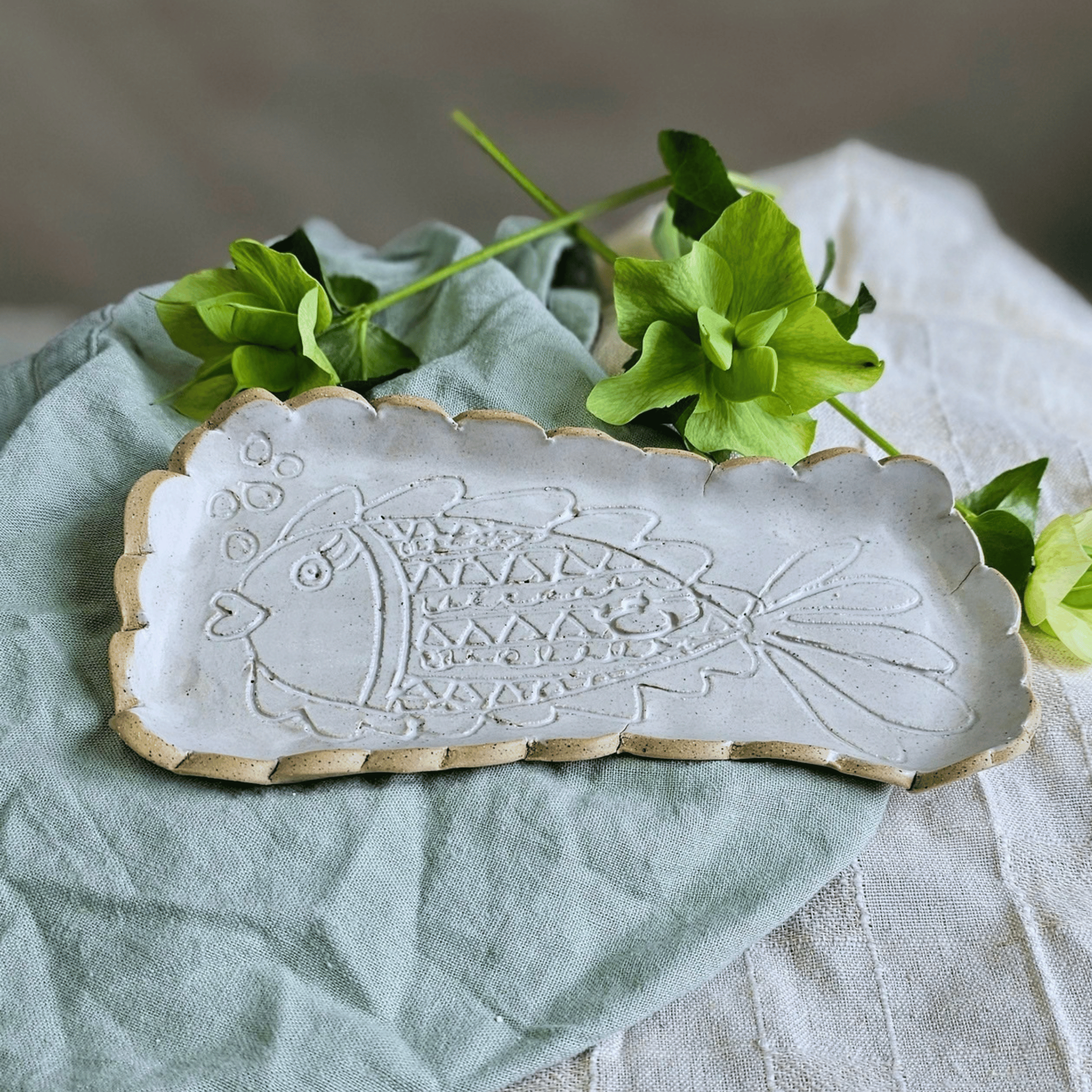 Just Keep Swimming_group_flatlay_curved trays_scalloped.png