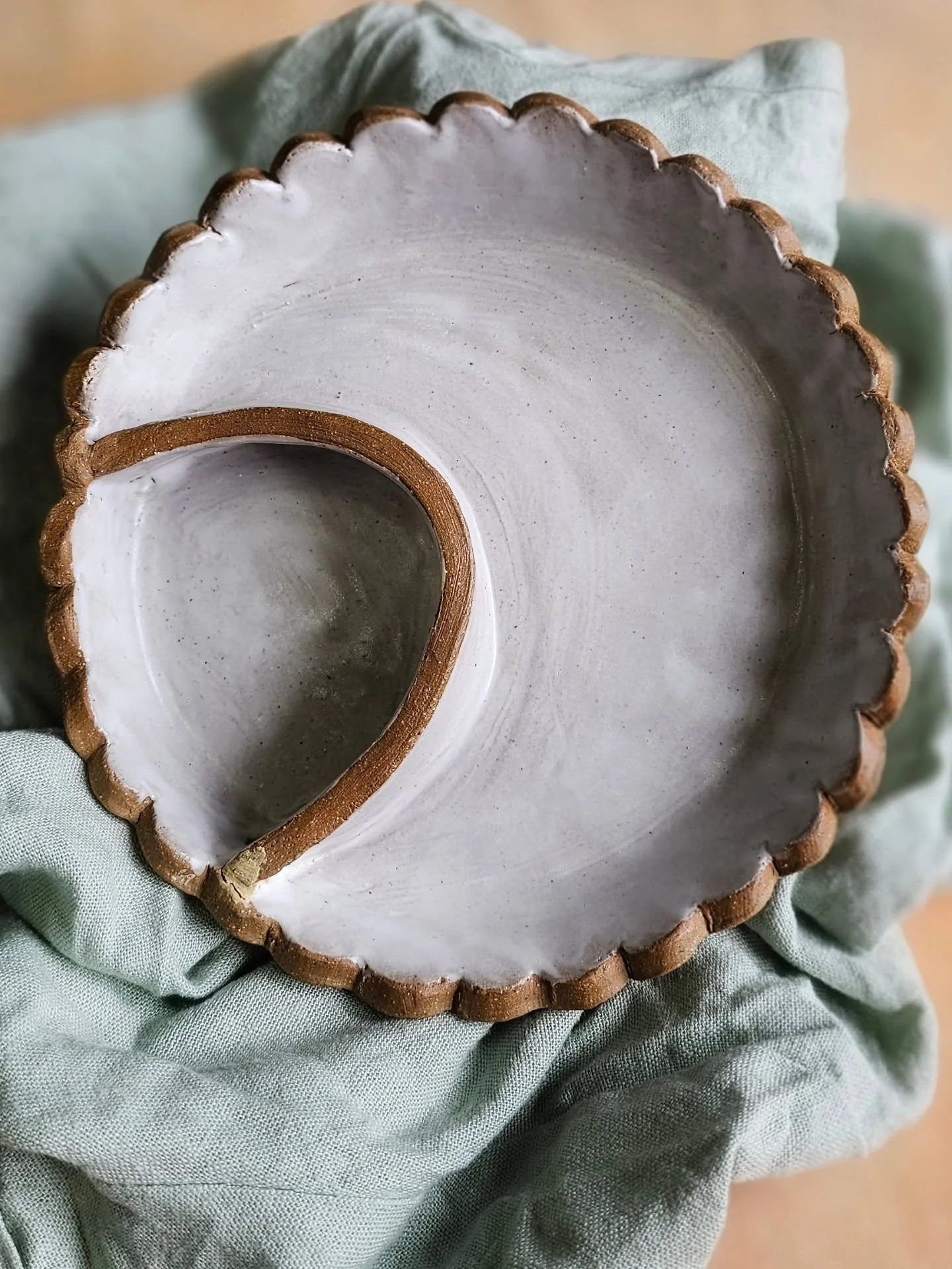 Behold the satin-white glow with a cheeky peek of clay showing through &mdash; my little snack diplomat is officially ready.

This handbuilt dish with a divider isn&rsquo;t just pretty; it keeps pistachios &amp; shells, olives &amp; pits, cherries &a