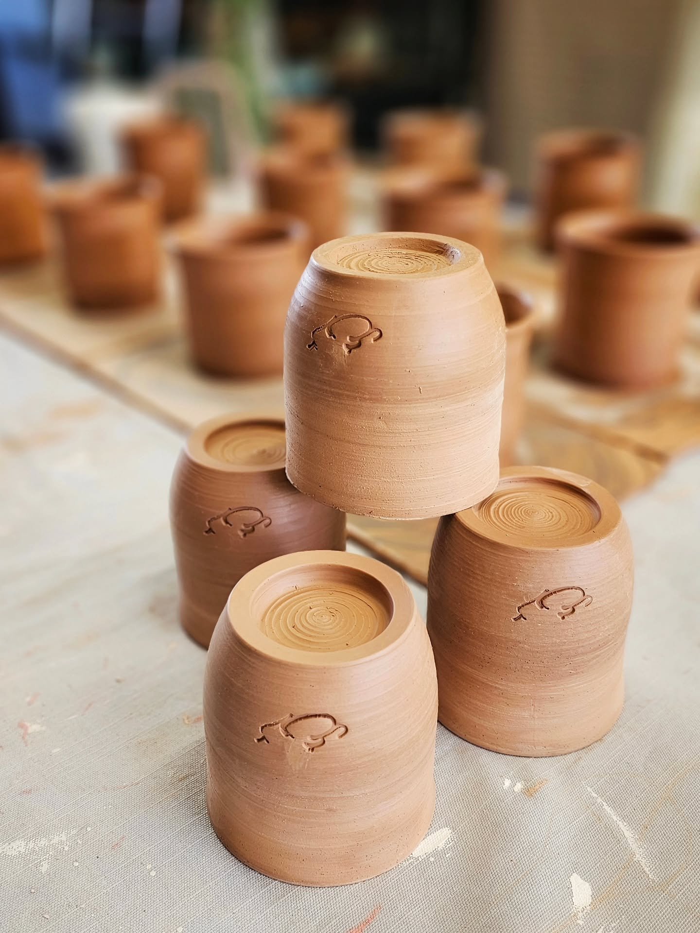 Practice Makes Progress (and Apparently&hellip; a Whole Lot More Mugs)

Yesterday I made four mugs &mdash; slow, steady, easing-back-into-it mugs. Today I trimmed them, added my maker&rsquo;s mark, and then somehow&hellip; made twelve more in the sam