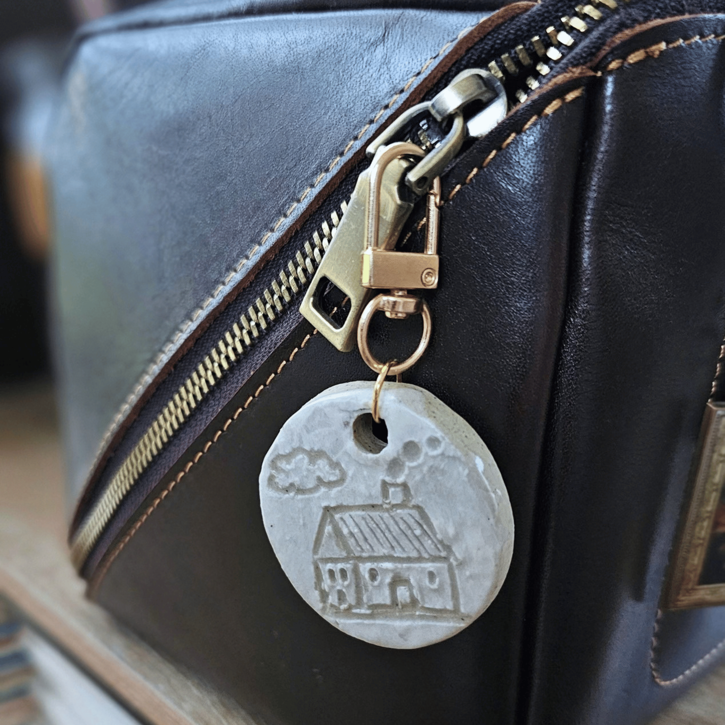Bag Buddies_sgraffito_white glaze_leather bag.png