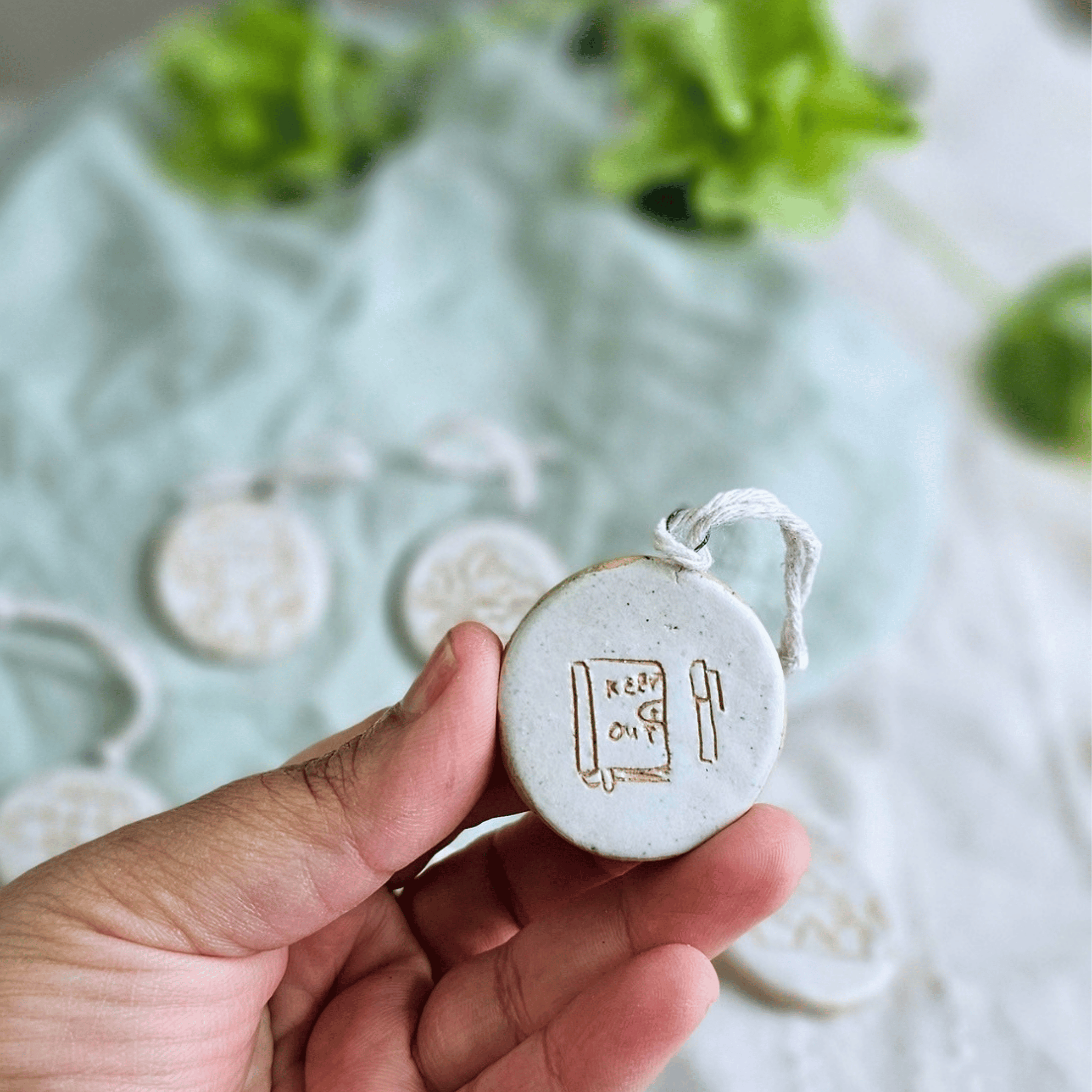 Mini Ornaments_sgraffito_white glaze_journal and pen.png