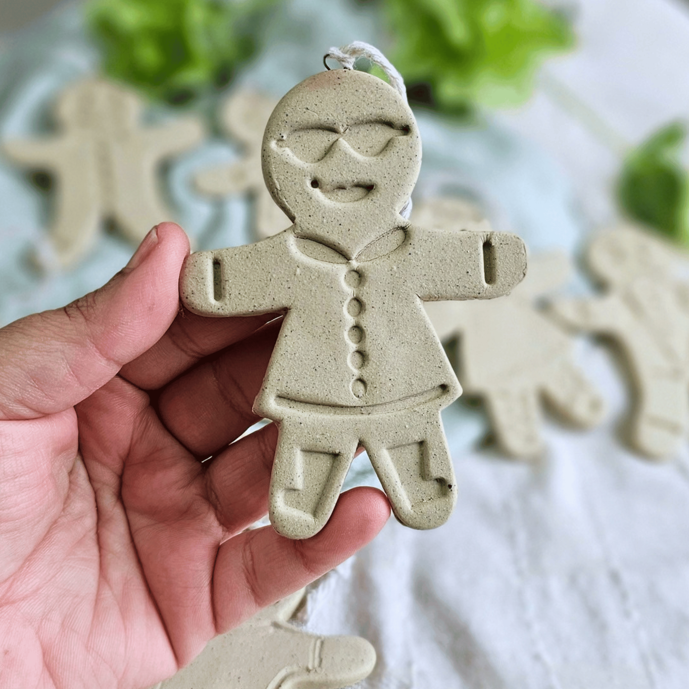 Gingies_raw clay_flatlay_in hands_cool chick.png
